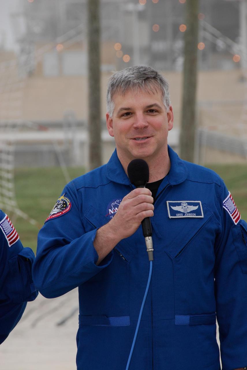 KENNEDY SPACE CENTER, FLA. -- At NASA Kennedy Space Center's Launch Pad 39A, the pilot of space shuttle Endeavour's STS-123 mission, Gregory H. Johnson, answers a question from the media during a break from emergency egress training. The crew is at Kennedy for a full launch dress rehearsal, known as the terminal countdown demonstration test or TCDT.  The terminal countdown demonstration test provides astronauts and ground crews with an opportunity to participate in various simulated countdown activities, including equipment familiarization and emergency training. Endeavour is targeted to launch March 11 at 2:28 a.m. EDT on a 16-day mission to the International Space Station.  On the mission, Endeavour and its crew will deliver the first section of the Japan Aerospace Exploration Agency's Kibo laboratory and the Canadian Space Agency's two-armed robotic system, Dextre. Photo credit: NASA/Kim Shiflett