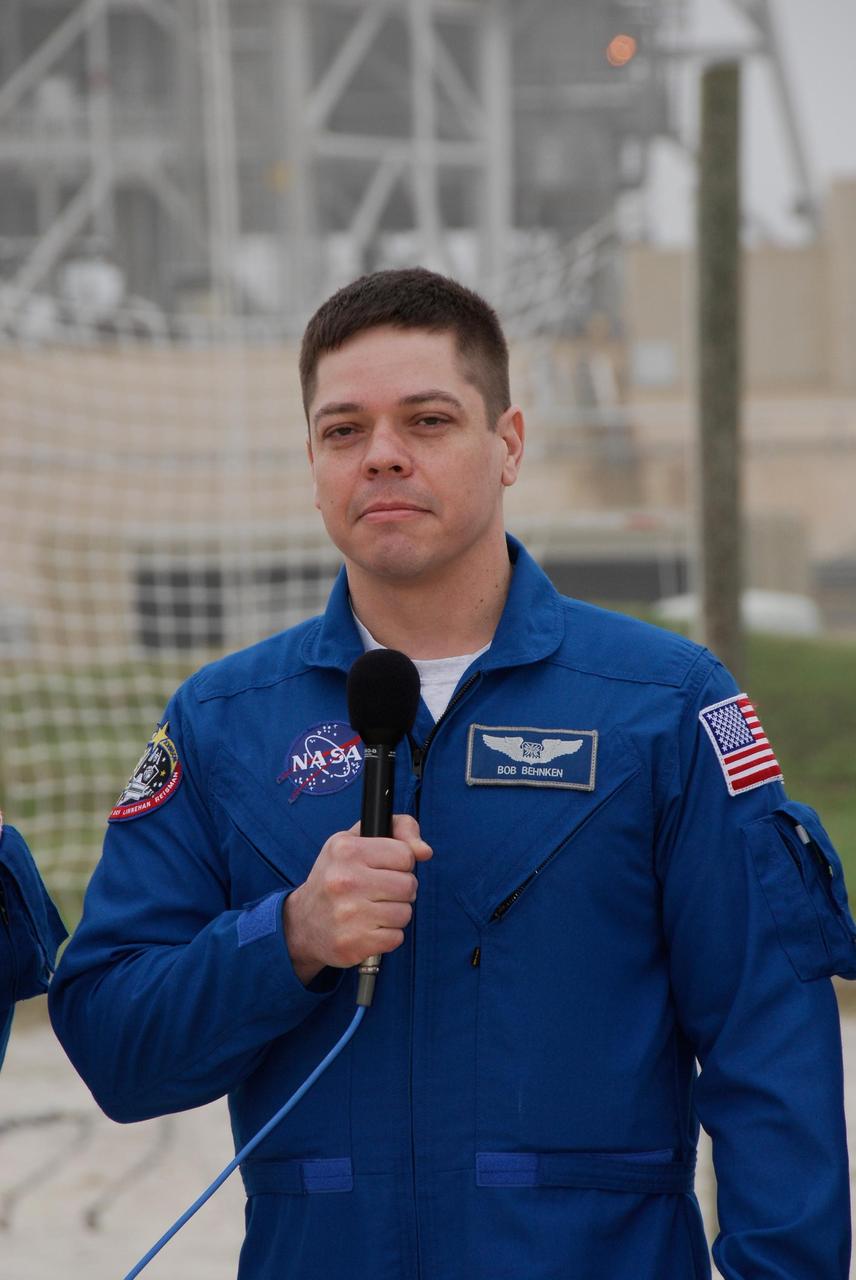 KENNEDY SPACE CENTER, FLA. -- At NASA Kennedy Space Center's Launch Pad 39A, a mission specialist on space shuttle Endeavour's STS-123 mission, Robert L. Behnken, answers a question from the media during a break from emergency egress training. The crew is at Kennedy for a full launch dress rehearsal, known as the terminal countdown demonstration test or TCDT. The terminal countdown demonstration test provides astronauts and ground crews with an opportunity to participate in various simulated countdown activities, including equipment familiarization and emergency training. Endeavour is targeted to launch March 11 at 2:28 a.m. EDT on a 16-day mission to the International Space Station. On the mission, Endeavour and its crew will deliver the first section of the Japan Aerospace Exploration Agency's Kibo laboratory and the Canadian Space Agency's two-armed robotic system, Dextre. Photo credit: NASA/Kim Shiflett