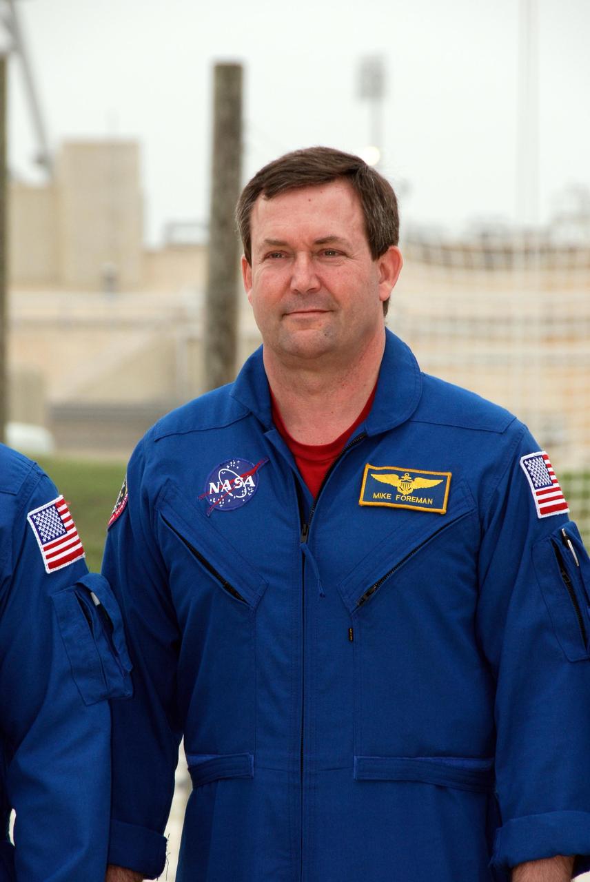 KENNEDY SPACE CENTER, FLA. -- At NASA Kennedy Space Center's Launch Pad 39A, a mission specialist on space shuttle Endeavour's STS-123 mission, Mike Foreman, prepares to take questions from the media during a break from emergency egress training. The crew is at Kennedy for a full launch dress rehearsal, known as the terminal countdown demonstration test or TCDT.  The terminal countdown demonstration test provides astronauts and ground crews with an opportunity to participate in various simulated countdown activities, including equipment familiarization and emergency training. Endeavour is targeted to launch March 11 at 2:28 a.m. EDT on a 16-day mission to the International Space Station.  On the mission, Endeavour and its crew will deliver the first section of the Japan Aerospace Exploration Agency's Kibo laboratory and the Canadian Space Agency's two-armed robotic system, Dextre. Photo credit: NASA/Kim Shiflett