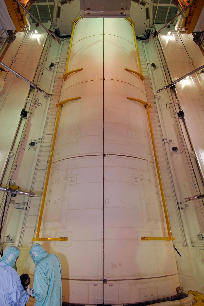 KENNEDY SPACE CENTER, FLA. --   On NASA Kennedy Space Center's Launch Pad 39A, workers check the fittings around space shuttle Endeavour's payload bay doors after closing.   Endeavour is targeted to launch March 11 at 2:28 a.m. EDT on the 16-day STS-123 mission to the International Space Station. Endeavour and its crew will deliver the ELM-PS and the Canadian Space Agency's two-armed robotic system, Dextre.   Photo credit: NASA/Dimitri Gerondidakis