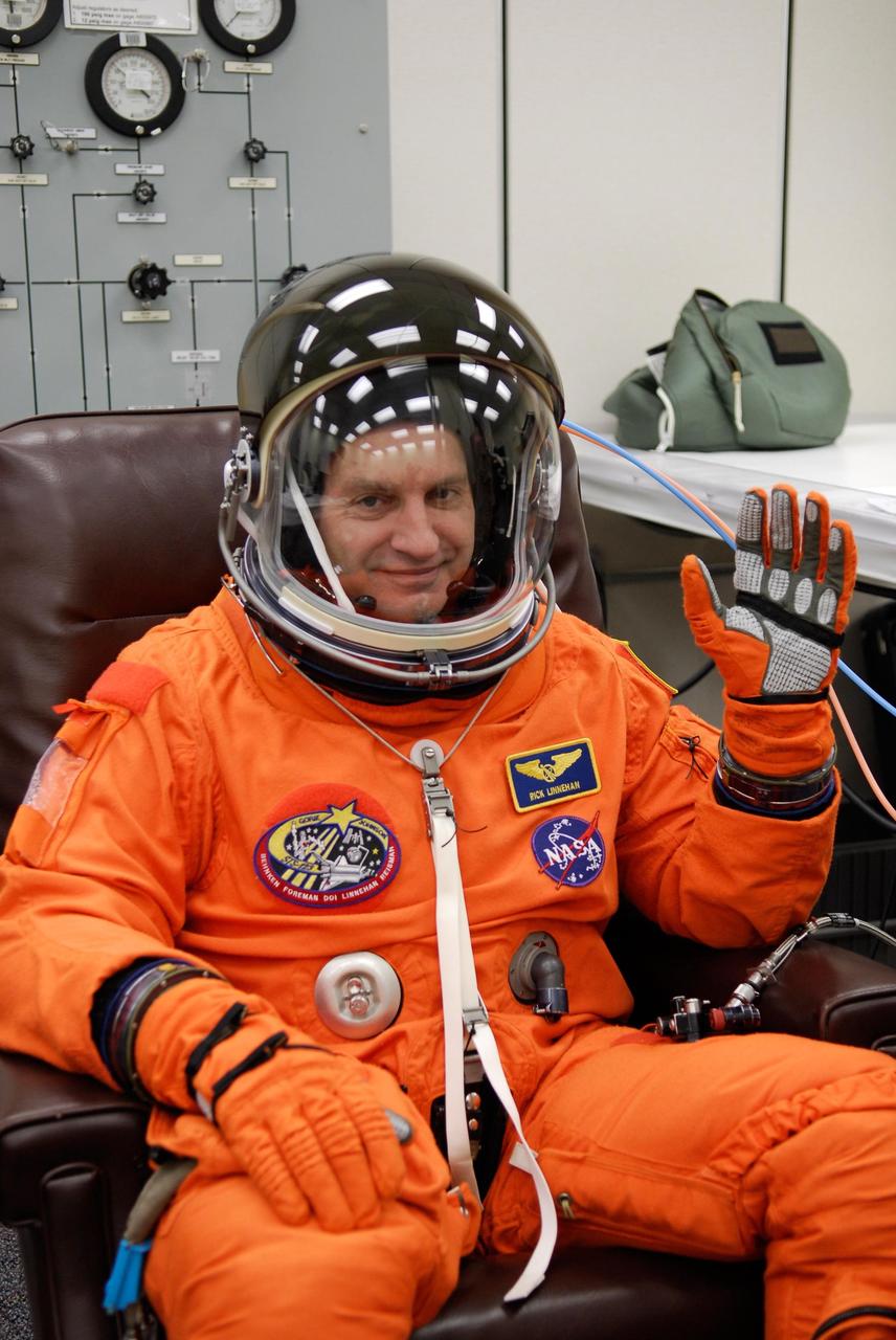 KENNEDY SPACE CENTER, FLA. --  STS-123 Mission Specialist Rick Linnehan is fully suited for the launch dress rehearsal, culmination of the terminal countdown demonstration test, or TCDT. The TCDT provides astronauts and ground crews with an opportunity to participate in various simulated countdown activities, including equipment familiarization and emergency training. Space shuttle Endeavour is targeted to launch March 11 at 2:28 a.m. EDT on the 16-day STS-123 mission to the International Space Station.  Endeavour and its crew will deliver the first section of the Japan Aerospace Exploration Agency's Kibo laboratory and the Canadian Space Agency's two-armed robotic system, Dextre.   Photo credit: NASA/Kim Shiflett