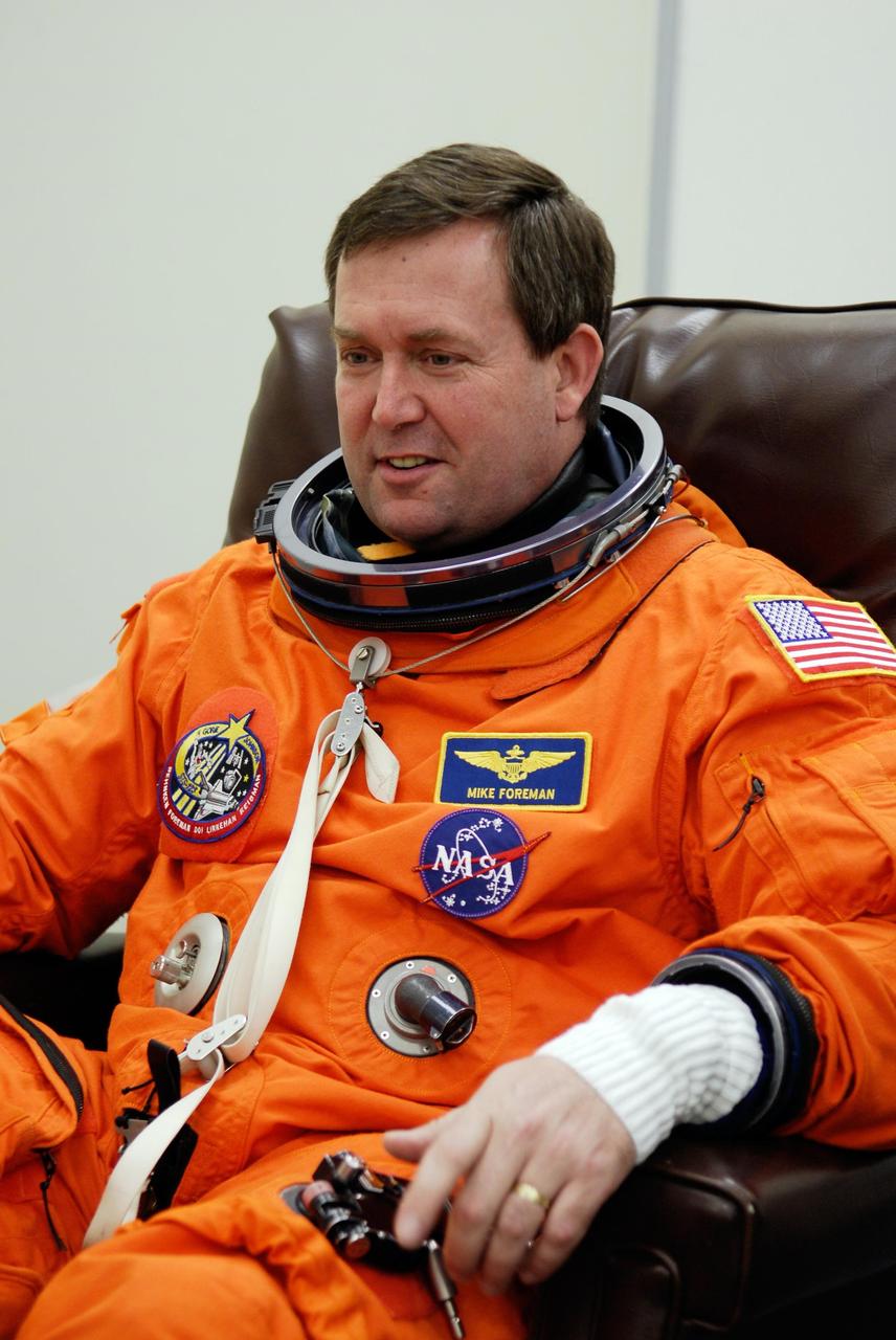 KENNEDY SPACE CENTER, FLA. --  STS-123 Mission Specialist Mike Foreman is ready to finish suiting up for the launch dress rehearsal, culmination of the terminal countdown demonstration test, or TCDT. The TCDT provides astronauts and ground crews with an opportunity to participate in various simulated countdown activities, including equipment familiarization and emergency training. Space shuttle Endeavour is targeted to launch March 11 at 2:28 a.m. EDT on the 16-day STS-123 mission to the International Space Station.  Endeavour and its crew will deliver the first section of the Japan Aerospace Exploration Agency's Kibo laboratory and the Canadian Space Agency's two-armed robotic system, Dextre.   Photo credit: NASA/Kim Shiflett