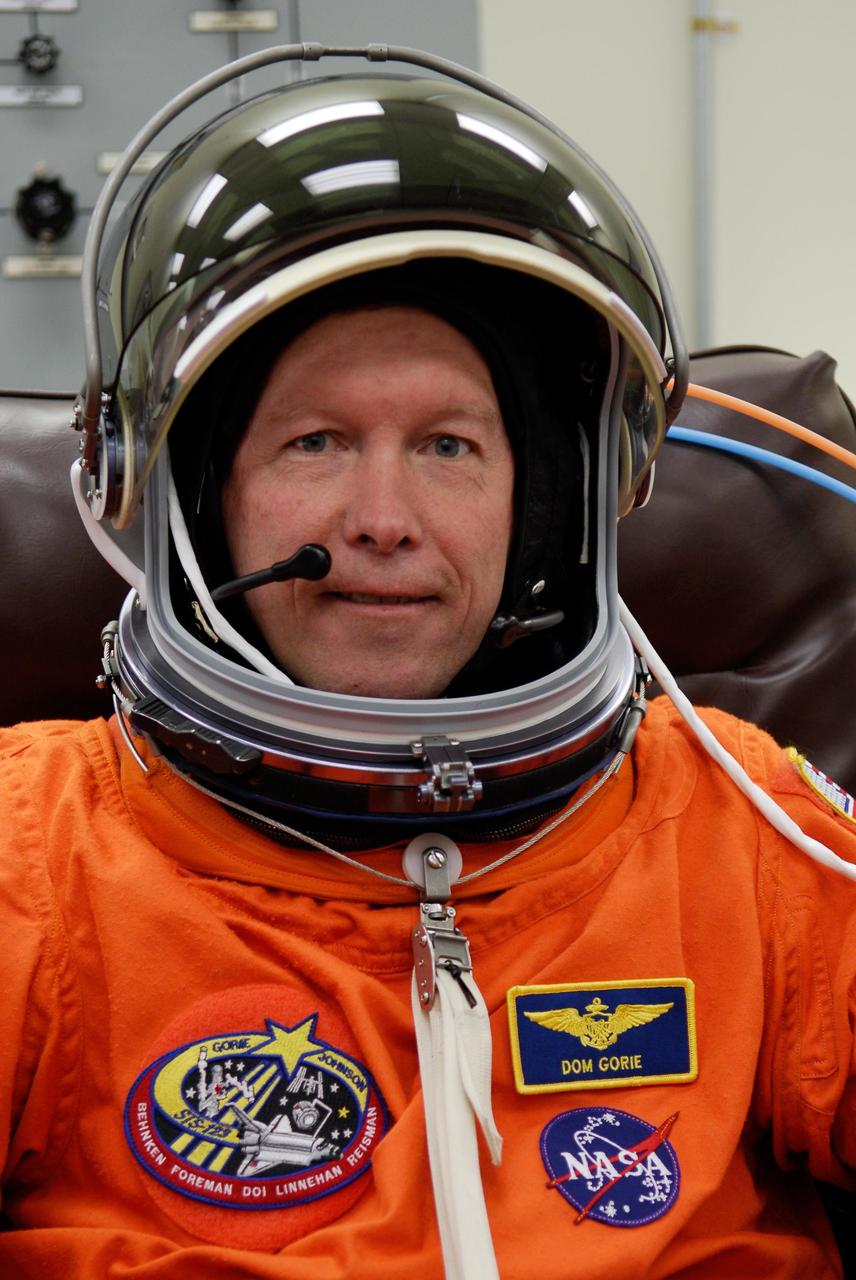 KENNEDY SPACE CENTER, FLA. --  STS-123 Commander Dominic Gorie is testing his helmet while suiting up for the launch dress rehearsal, culmination of the terminal countdown demonstration test, or TCDT.  The TCDT provides astronauts and ground crews with an opportunity to participate in various simulated countdown activities, including equipment familiarization and emergency training. Space shuttle Endeavour is targeted to launch March 11 at 2:28 a.m. EDT on the 16-day STS-123 mission to the International Space Station.  Endeavour and its crew will deliver the first section of the Japan Aerospace Exploration Agency's Kibo laboratory and the Canadian Space Agency's two-armed robotic system, Dextre.   Photo credit: NASA/Kim Shiflett