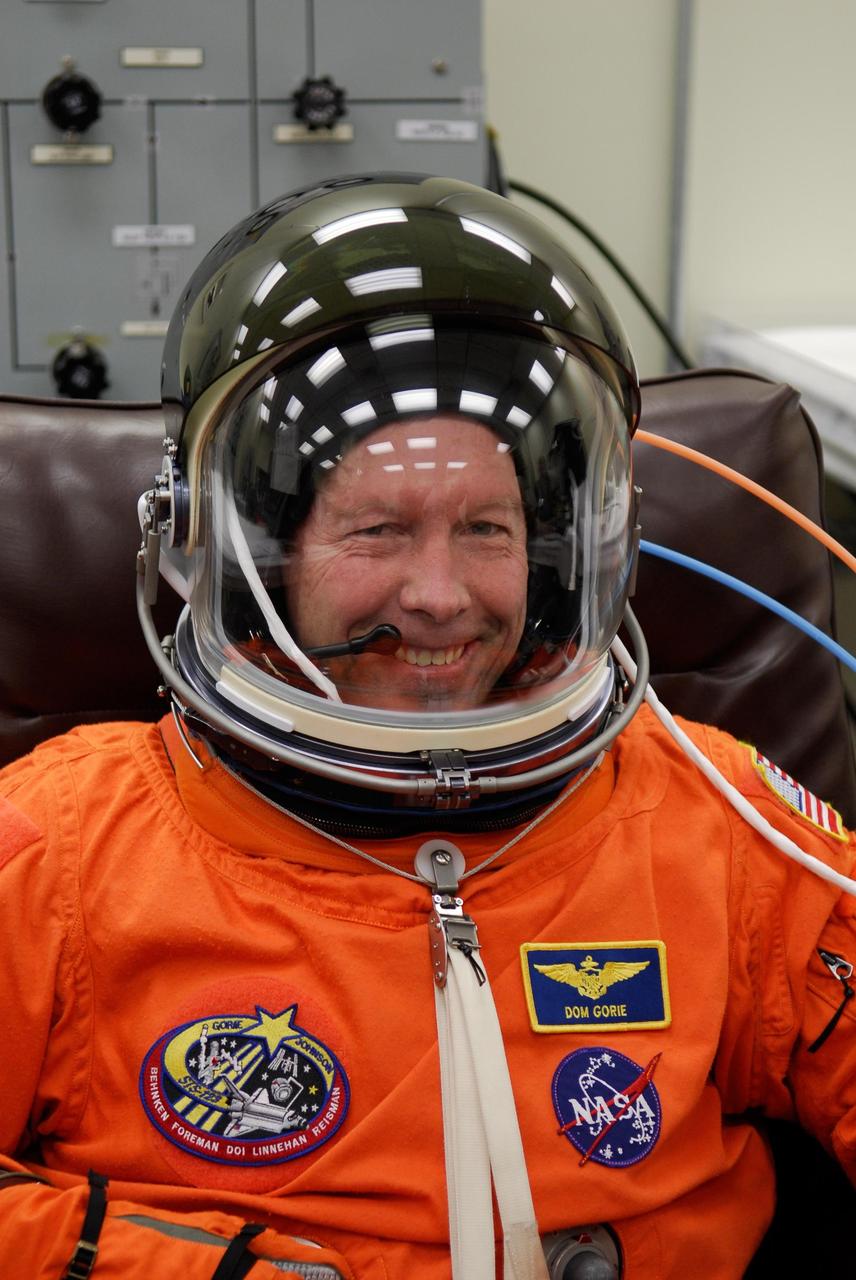 KENNEDY SPACE CENTER, FLA. -- STS-123 Commander Dominic Gorie tests the communications in his helmet before the launch dress rehearsal, culmination of the terminal countdown demonstration test, or TCDT. The TCDT provides astronauts and ground crews with an opportunity to participate in various simulated countdown activities, including equipment familiarization and emergency training. Space shuttle Endeavour is targeted to launch March 11 at 2:28 a.m. EDT on the 16-day STS-123 mission to the International Space Station. Endeavour and its crew will deliver the first section of the Japan Aerospace Exploration Agency's Kibo laboratory and the Canadian Space Agency's two-armed robotic system, Dextre. Photo credit: NASA/Kim Shiflett