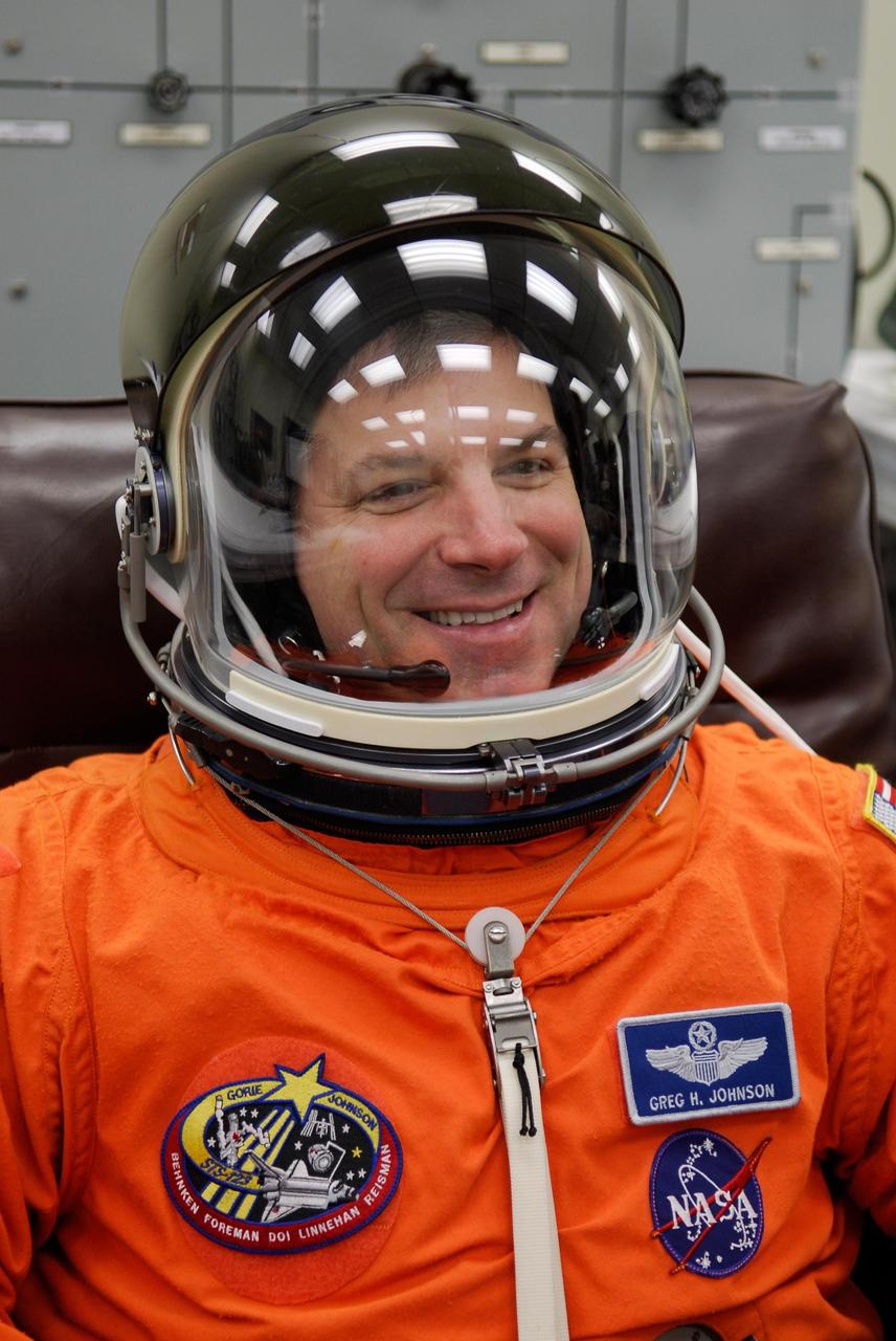 KENNEDY SPACE CENTER, FLA. --  STS-123 Pilot Gregory H. Johnson tests the communications in his helmet before the launch dress rehearsal, culmination of the terminal countdown demonstration test, or TCDT. The TCDT provides astronauts and ground crews with an opportunity to participate in various simulated countdown activities, including equipment familiarization and emergency training. Space shuttle Endeavour is targeted to launch March 11 at 2:28 a.m. EDT on the 16-day STS-123 mission to the International Space Station.  Endeavour and its crew will deliver the first section of the Japan Aerospace Exploration Agency's Kibo laboratory and the Canadian Space Agency's two-armed robotic system, Dextre.   Photo credit: NASA/Kim Shiflett