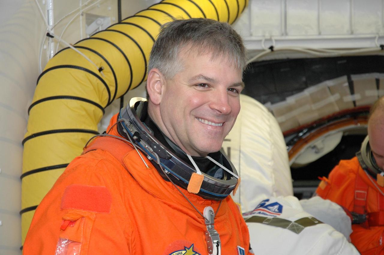 KENNEDY SPACE CENTER, FLA. --  STS-123 Pilot Gregory H. Johnson is in the White Room on NASA Kennedy Space Center's Launch Pad 39A, getting ready to enter space shuttle Endeavour for the simulated launch countdown.  The countdown is the culmination of the terminal countdown demonstration test, or TCDT. The TCDT provides astronauts and ground crews with an opportunity to participate in various countdown activities, including equipment familiarization and emergency egress training. Endeavour is targeted to launch at 2:28 a.m. EDT March 11 on the 16-day STS-123 mission to the International Space Station.  Endeavour and its crew will deliver the first section of the Japan Aerospace Exploration Agency's Kibo laboratory and the Canadian Space Agency's two-armed robotic system, Dextre.   Photo credit: NASA/Jim Grossmann