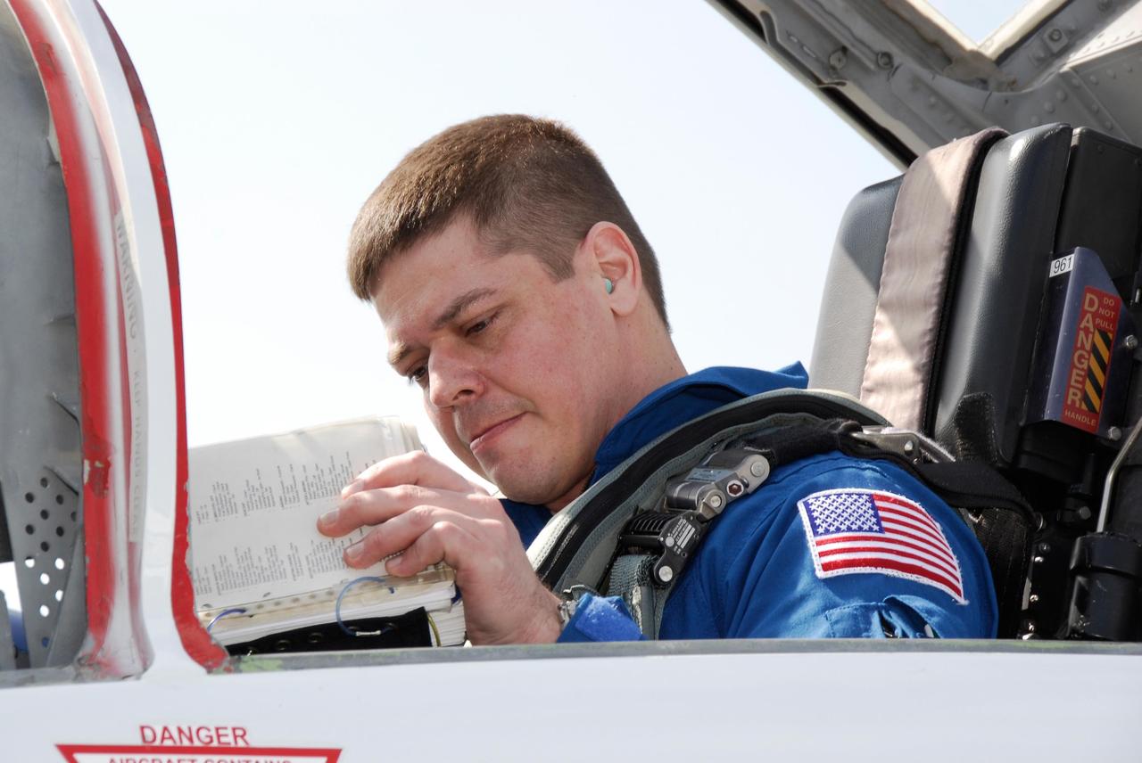 KENNEDY SPACE CENTER, FLA. -- At the NASA Kennedy Space Center's Shuttle Landing Facility, STS-123 Mission Specialist Robert L. Behnken waits in the aircraft that will return him to Houston. He and the other STS-123 crew members took part in a terminal countdown demonstration test, or TCDT, in preparation for the launch of space shuttle Endeavour scheduled on March 11. The TCDT enables astronauts and ground crews to participate in various countdown activities, including equipment familiarization and emergency egress training. On the STS-123 mission, Endeavour and its crew will deliver the first section of the Japan Aerospace Exploration Agency's Kibo laboratory and the Canadian Space Agency's two-armed robotic system, Dextre Photo credit: NASA/Kim Shiflett