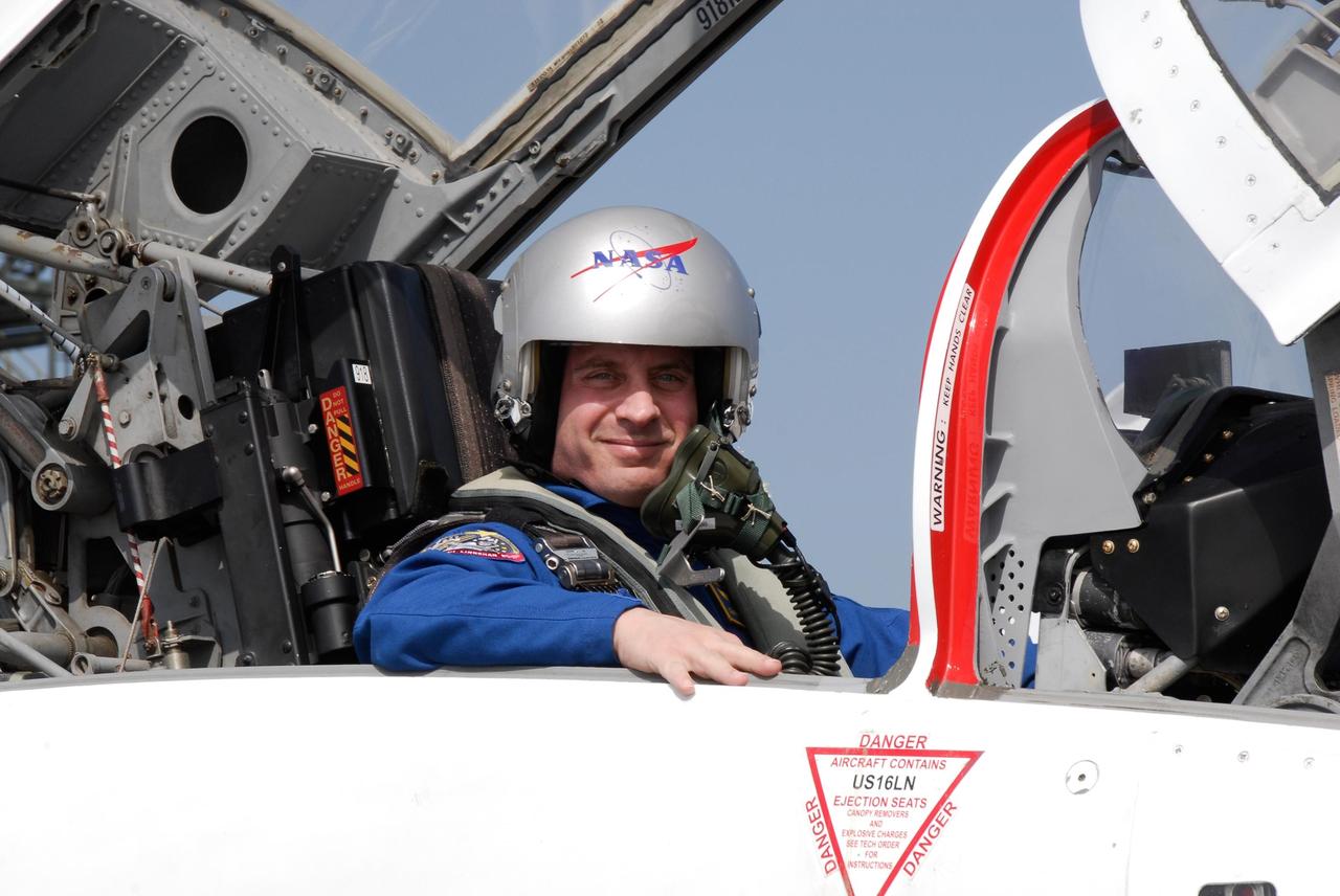 KENNEDY SPACE CENTER, FLA. -- At the NASA Kennedy Space Center's Shuttle Landing Facility, STS-123 Mission Specialist Garrett Reisman waits in the jet aircraft that will return him Houston. He and the other STS-123 crew members took part in a terminal countdown demonstration test, or TCDT, in preparation for the launch of space shuttle Endeavour scheduled on March 11. The TCDT enables astronauts and ground crews to participate in various countdown activities, including equipment familiarization and emergency egress training. On the STS-123 mission, Endeavour and its crew will deliver the first section of the Japan Aerospace Exploration Agency's Kibo laboratory and the Canadian Space Agency's two-armed robotic system, Dextre Photo credit: NASA/Kim Shiflett