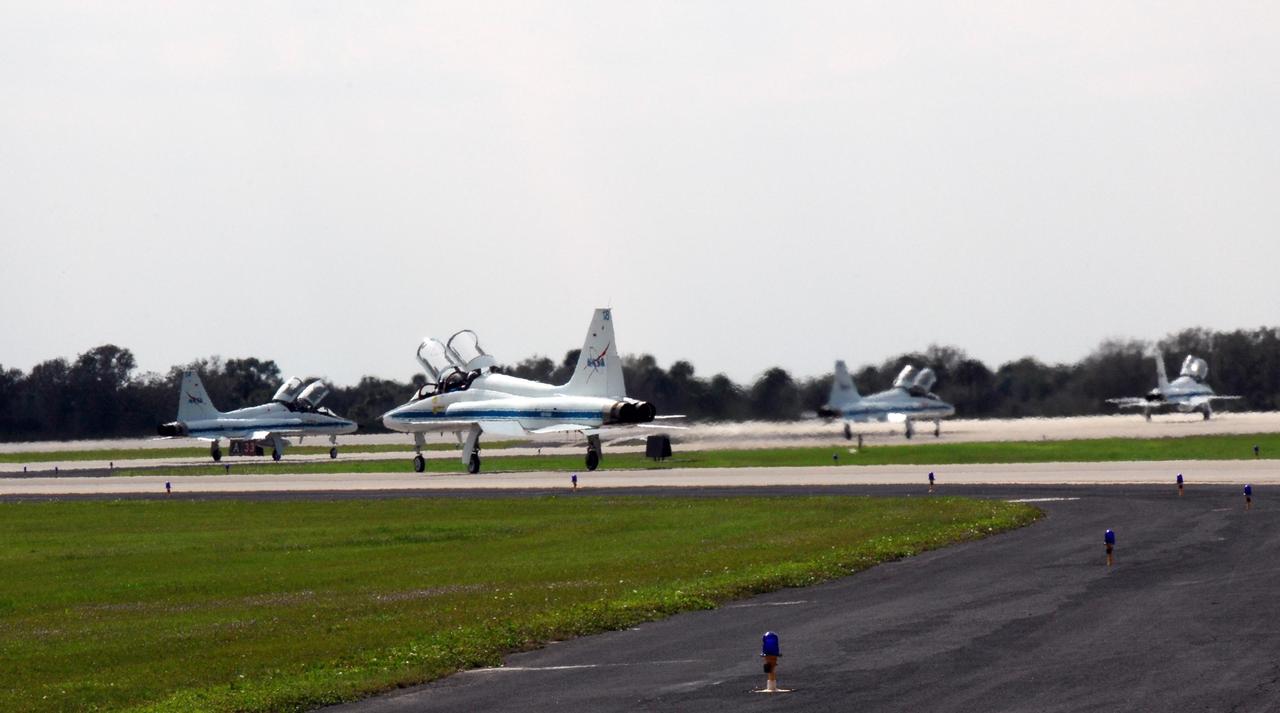 KENNEDY SPACE CENTER, FLA. -- At the NASA Kennedy Space Center's Shuttle Landing Facility, the jet aircraft carrying STS-123 crewmembers line up for takeoff on the return trip to Houston.  The STS-123 crew took part in a terminal countdown demonstration test, or TCDT, in preparation for the launch of space shuttle Endeavour scheduled on March 11. The TCDT enables astronauts and ground crews to participate in various countdown activities, including equipment familiarization and emergency egress training. On the STS-123 mission, Endeavour and its crew will deliver the first section of the Japan Aerospace Exploration Agency's Kibo laboratory and the Canadian Space Agency's two-armed robotic system, Dextre  Photo credit: NASA/Kim Shiflett