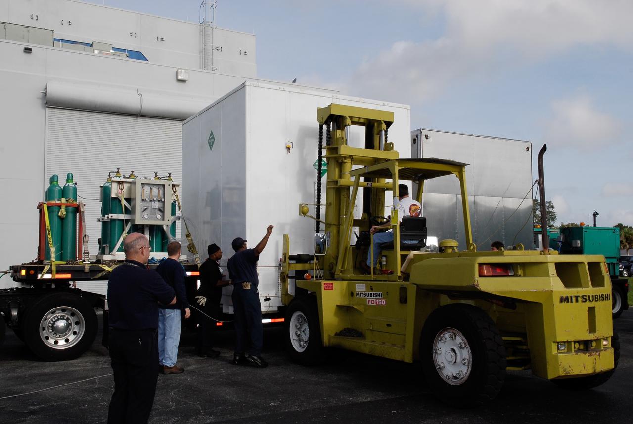 KENNEDY SPACE CENTER, FLA. --  The shipping container holding NASA's Gamma-Ray Large Area Space Telescope, or GLAST, is removed from the truck at the Astrotech payload processing facility near the Kennedy Space Center to begin prelaunch activities. The GLAST will launch aboard a Delta II rocket May 16 from Launch Pad 17-B on Cape Canaveral Air Force Station.  A powerful space observatory, the GLAST will explore the most extreme environments in the universe, and answer questions about supermassive black hole systems, pulsars and the origin of cosmic rays. It also will study the mystery of powerful explosions known as gamma-ray bursts.  Photo credit: NASA/Kim Shiflett