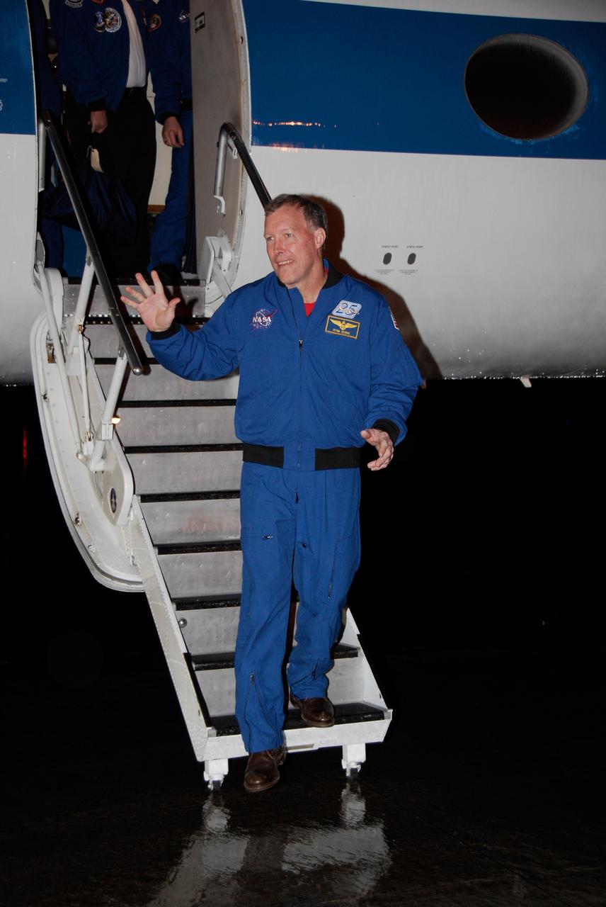 KENNEDY SPACE CENTER, FLA. -- The crew of space shuttle Endeavour's STS-123 mission arrives at NASA Kennedy Space Center's Shuttle Landing Facility for launch at 2:28 a.m. EDT on March 11.  Exiting the plane is Commander Dominic Gorie, who will be making his fourth shuttle flight.  On this mission to the International Space Station, Endeavour and its crew will deliver the first section of the Japan Aerospace Exploration Agency's Kibo laboratory and the Canadian Space Agency's two-armed robotic system, Dextre.   Photo credit: NASA/Kim Shiflett