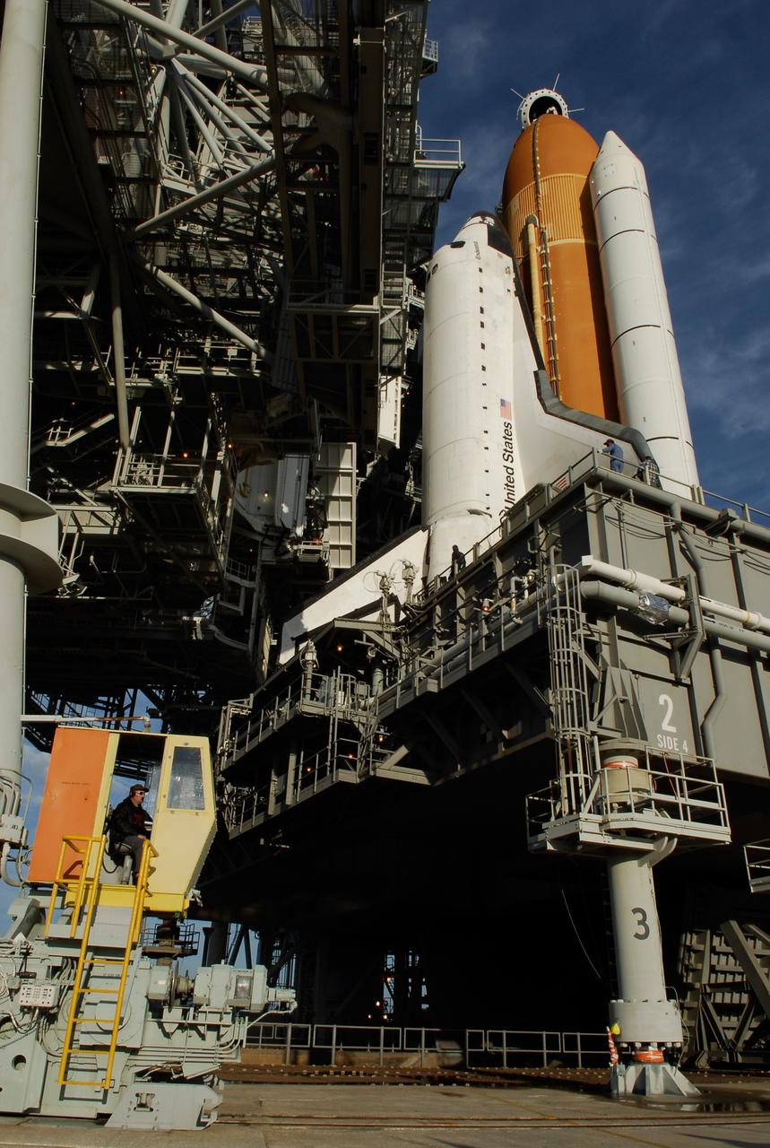 KENNEDY SPACE CENTER, FLA. -- On Launch Pad 39A at NASA's Kennedy Space Center, the rotating service structure is rolling on its axis to uncover space shuttle Endeavour. First motion was at 8:23 a.m. and rollback was complete at 8:55 a.m. The structure provides protected access to the orbiter for changeout and servicing of payloads at the pad. The structure is supported by a rotating bridge that pivots about a vertical axis on the west side of the pad's flame trench. After the RSS is rolled back, the orbiter is ready for fuel cell activation and external tank cryogenic propellant loading operations. The pad is cleared to the perimeter gate for operations to fill the external tank with about 500,000 gallons of cryogenic propellants used by the shuttle’s main engines. This is done at the pad approximately eight hours before the scheduled launch. Endeavour and its crew will deliver the first section of the Japan Aerospace Exploration Agency's Kibo laboratory and the Canadian Space Agency's two-armed robotic system, Dextre. Launch is scheduled for 2:28 a.m. EDT March 11. Photo credit: NASA/Kim Shiflett