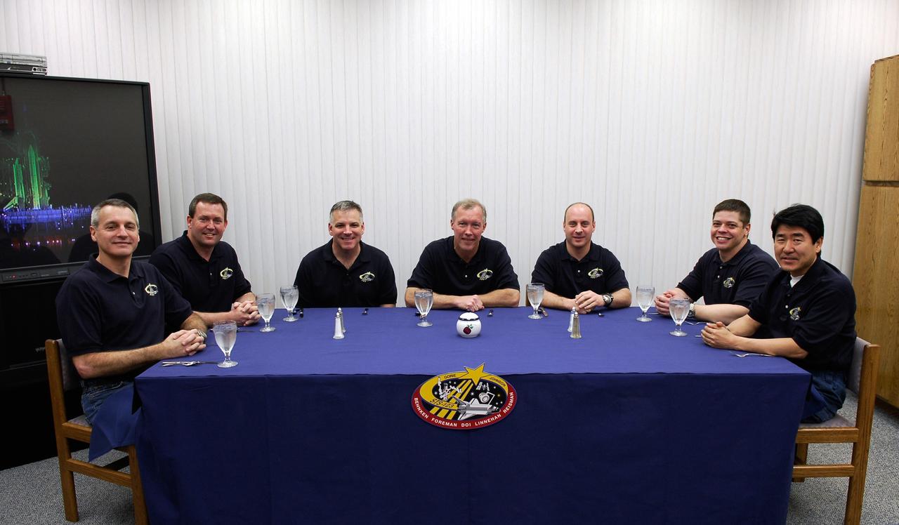 KENNEDY SPACE CENTER, FLA. -- Honoring tradition, the crew of space shuttle Endeavour's STS-123 mission pose for a photo at the breakfast table. From left are Mission Specialists Rick Linnehan and Mike Foreman; Pilot Gregory H. Johnson; Commander Dominic Gorie; and Mission Specialists Garrett Reisman, who will remain on the International Space Station as a flight engineer, Robert L. Behnken, and Takao Doi of the Japan Aerospace Exploration Agency. The crew will make a record-breaking 16-day mission to the International Space Station. On STS-123, Endeavour and its crew will deliver the first section of the Japan Aerospace Exploration Agency's Kibo laboratory and the Canadian Space Agency's two-armed robotic system, Dextre. Launch is scheduled for 2:28 a.m. EDT March 11. Photo credit: NASA/Kim Shiflett