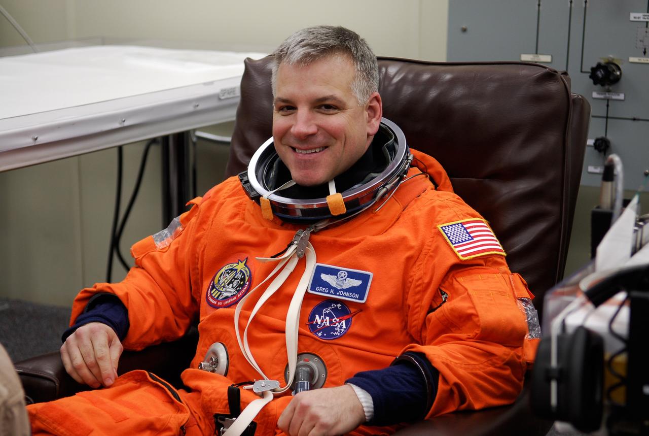 KENNEDY SPACE CENTER, FLA. -- STS-123 Pilot Gregory H. Johnson dons his launch and entry suit before heading to Launch Pad 39A for liftoff on space shuttle Endeavour. The crew will make a record-breaking 16-day mission to the International Space Station. On STS-123, Endeavour and its crew will deliver the first section of the Japan Aerospace Exploration Agency's Kibo laboratory and the Canadian Space Agency's two-armed robotic system, Dextre. Launch is scheduled for 2:28 a.m. EDT March 11. Photo credit: NASA/Kim Shiflett
