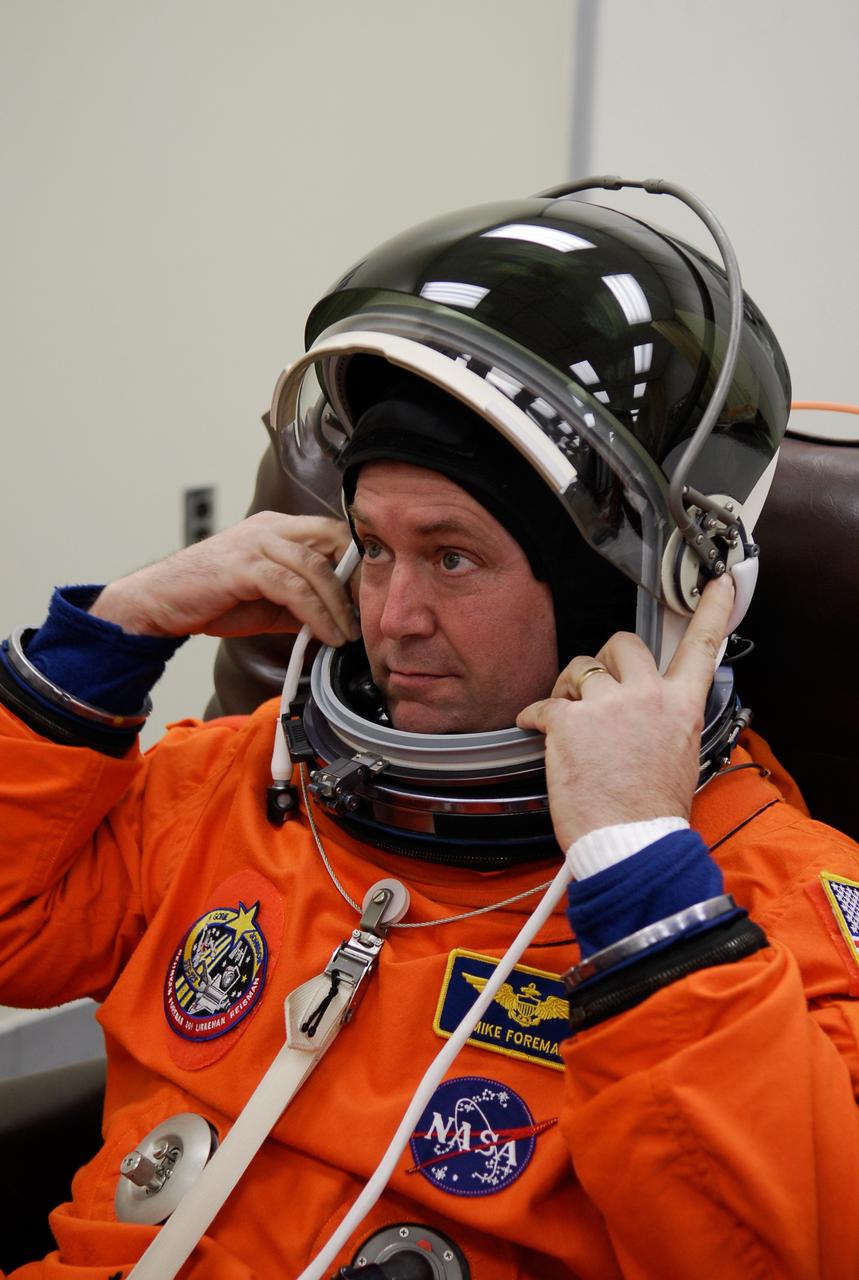 KENNEDY SPACE CENTER, FLA. -- STS-123 Mission Specialist Mike Foreman tests the communication in his helmet as he suits up before heading to Launch Pad 39A for liftoff on space shuttle Endeavour. The crew will make a record-breaking 16-day mission to the International Space Station. On STS-123, Endeavour and its crew will deliver the first section of the Japan Aerospace Exploration Agency's Kibo laboratory and the Canadian Space Agency's two-armed robotic system, Dextre. Launch is scheduled for 2:28 a.m. EDT March 11. Photo credit: NASA/Kim Shiflett