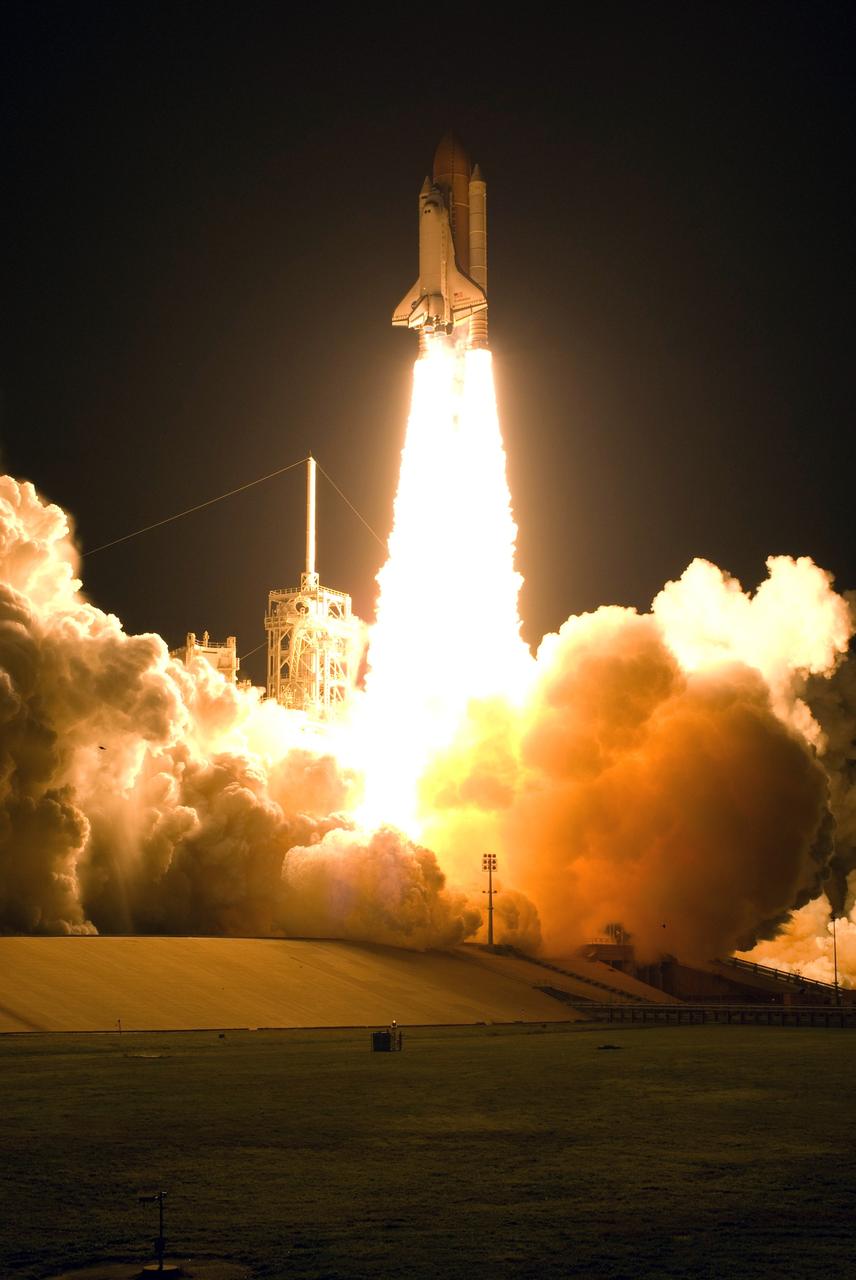 KENNEDY SPACE CENTER, FLA. --  Liftoff of space shuttle Endeavour on the STS-123 mission lights up Launch Pad 39A and the night sky.  Liftoff was on time at 2:28 a.m. EDT.  The crew will make a record-breaking 16-day mission to the International Space Station and deliver the first section of the Japan Aerospace Exploration Agency's Kibo laboratory and the Canadian Space Agency's two-armed robotic system, Dextre.  Photo credit: NASA/Sandra Joseph, Tony Gray, Robert Murray