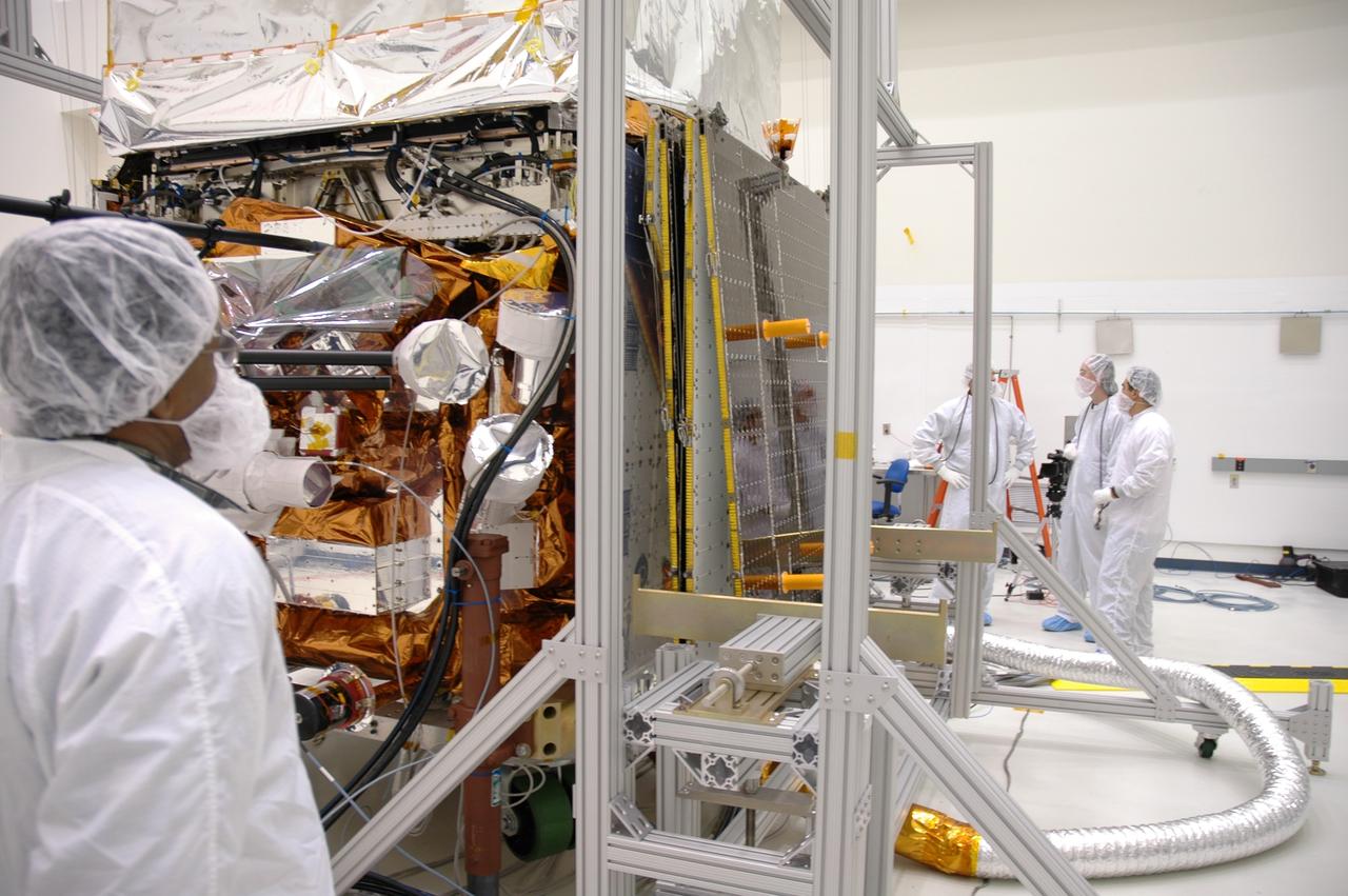 CAPE CANAVERAL, Fla. ---  In the Astrotech payload processing facility, NASA's Gamma-Ray Large Area Space Telescope, or GLAST, completes the test of the deployment mechanism on its solar arrays. The telescope will launch aboard a Delta II rocket May 16 from Launch Pad 17-B on Cape Canaveral Air Force Station. A powerful space observatory, the GLAST will explore the most extreme environments in the universe, and answer questions about supermassive black hole systems, pulsars and the origin of cosmic rays. It also will study the mystery of powerful explosions known as gamma-ray bursts.  Photo credit: NASA/Jim Grossmann