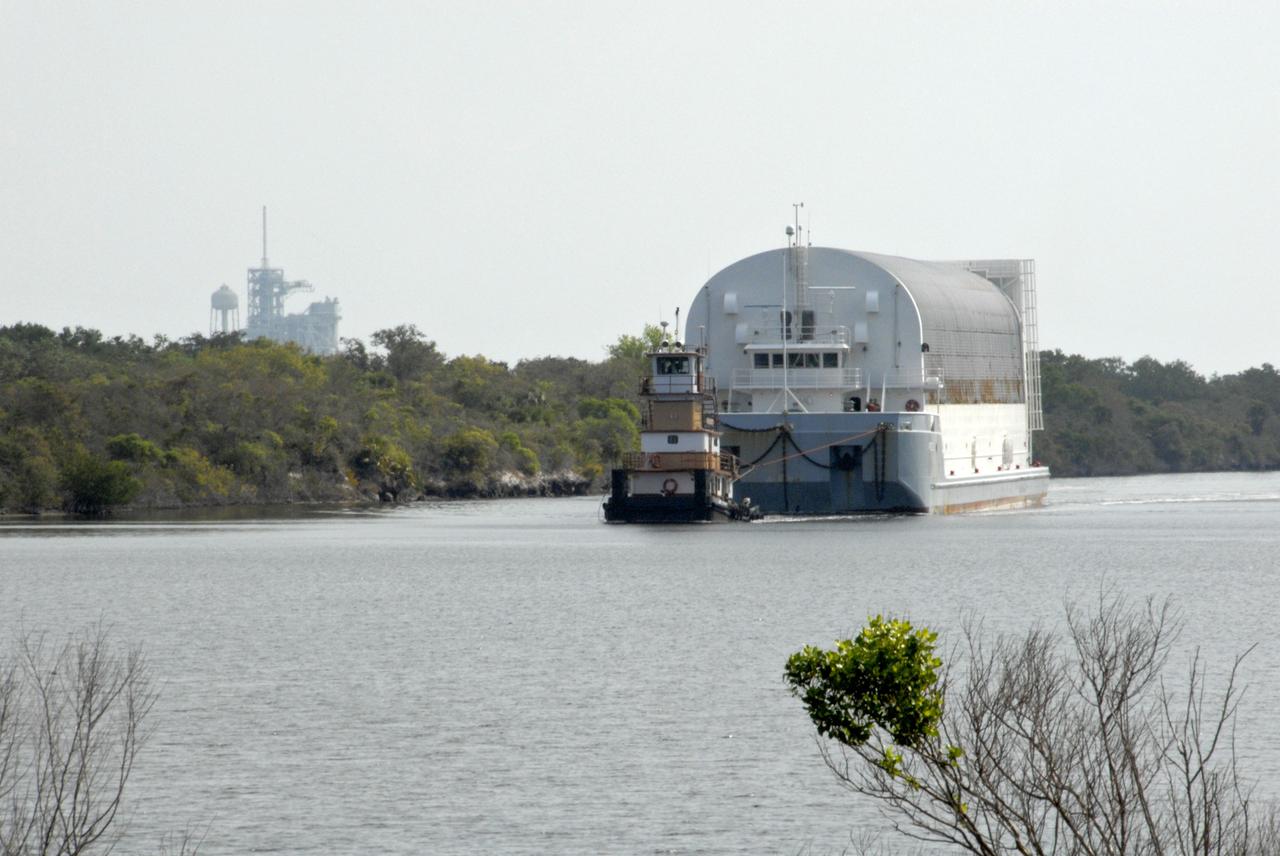 CAPE CANAVERAL, Fla. --- A tugboat tows the Pegasus barge through the turn basin in the Launch Complex 39 Area at NASA's Kennedy Space Center. The barge is carrying external tank No. 128 for space shuttle Discovery's STS-124 mission. After offloading, the tank will be transported to the Vehicle Assembly Building. On the STS-124 mission, Discovery will transport the Kibo Japanese Experiment Module - Pressurized Module and the Japanese Remote Manipulator System to the International Space Station. Discovery is targeted for launch on May 25. Photo credit: NASA/Dimitri Gerondidakis