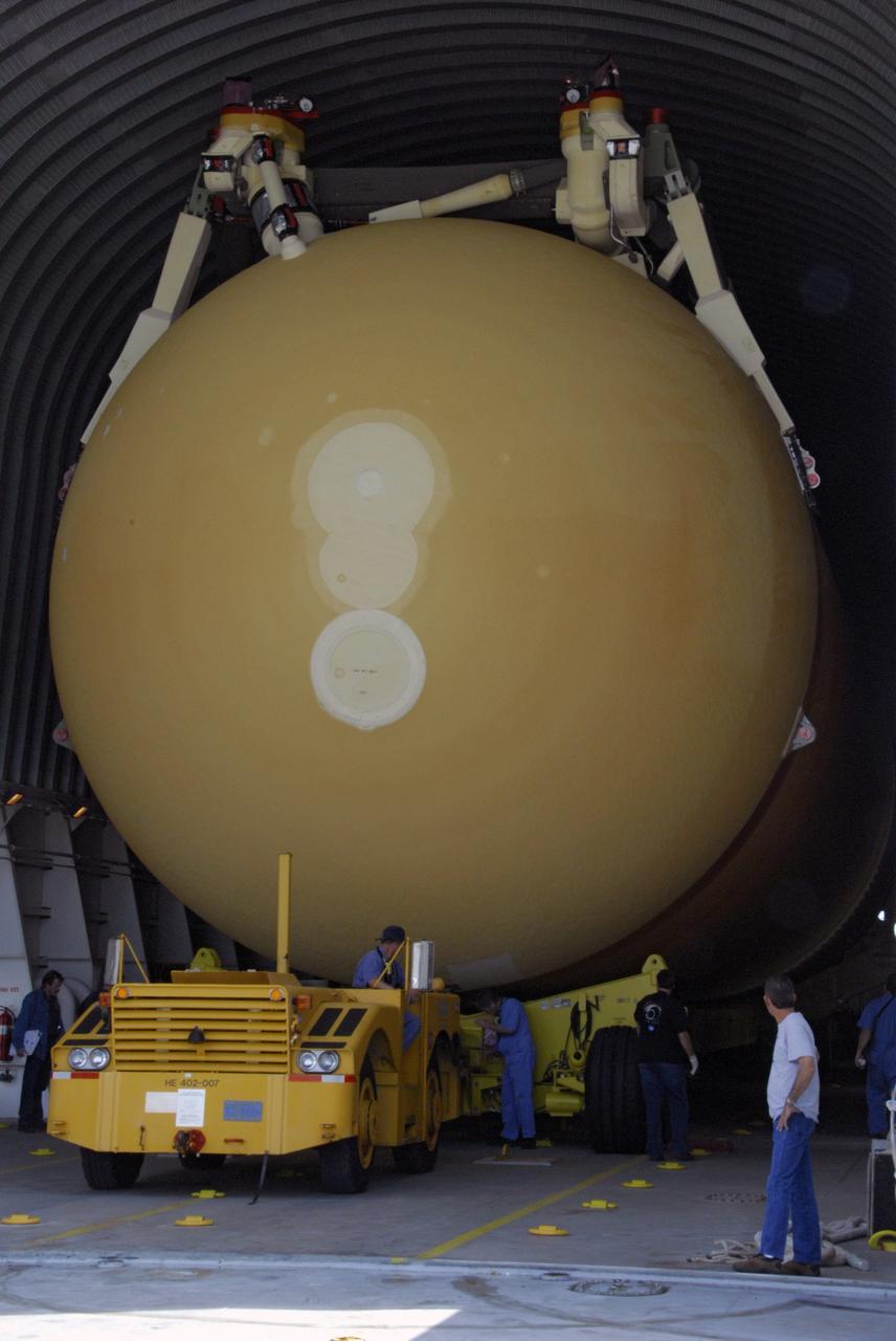 CAPE CANAVERAL, Fla. ---   A tow vehicle prepares to offload external tank No. 128 from the Pegasus barge in the Launch Complex 39 Area at NASA's Kennedy Space Center.  The tank is scheduled for space shuttle Discovery's STS-124 mission. After offloading, the tank will be transported to the Vehicle Assembly Building.  On the STS-124 mission, Discovery will transport the Kibo Japanese Experiment Module - Pressurized Module and the Japanese Remote Manipulator System to the International Space Station. Discovery is targeted for launch on May 25.  Photo credit: NASA/Dimitri Gerondidakis