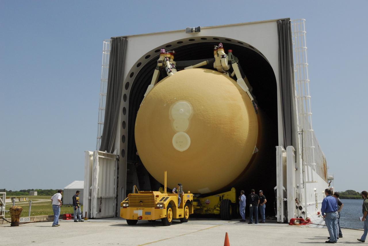 CAPE CANAVERAL, Fla. ---  A tow vehicle begins offloading external tank No. 128 from the Pegasus barge in the Launch Complex 39 Area at NASA's Kennedy Space Center.  The tank is scheduled for space shuttle Discovery's STS-124 mission. After offloading, the tank will be transported to the Vehicle Assembly Building.  On the STS-124 mission, Discovery will transport the Kibo Japanese Experiment Module - Pressurized Module and the Japanese Remote Manipulator System to the International Space Station. Discovery is targeted for launch on May 25.  Photo credit: NASA/Dimitri Gerondidakis
