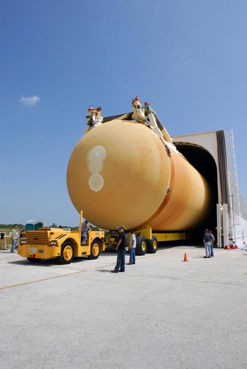 CAPE CANAVERAL, Fla. ---  A tow vehicle offloads external tank No. 128 from the Pegasus barge in the Launch Complex 39 Area at NASA's Kennedy Space Center.  The tank is scheduled for space shuttle Discovery's STS-124 mission. After offloading, the tank will be transported to the Vehicle Assembly Building.  On the STS-124 mission, Discovery will transport the Kibo Japanese Experiment Module - Pressurized Module and the Japanese Remote Manipulator System to the International Space Station. Discovery is targeted for launch on May 25.  Photo credit: NASA/Dimitri Gerondidakis