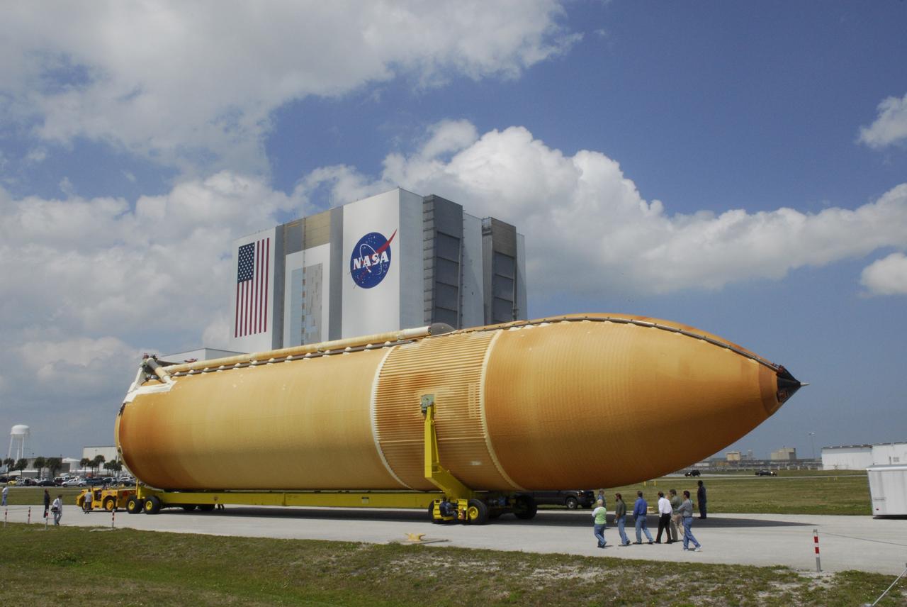 CAPE CANAVERAL, Fla. --- External tank No. 128 is towed from the turn basin in the Launch Complex 39 Area at NASA's Kennedy Space Center to the Vehicle Assembly Building, in the background. The tank is scheduled for space shuttle Discovery's STS-124 mission. On the STS-124 mission, Discovery will transport the Kibo Japanese Experiment Module - Pressurized Module and the Japanese Remote Manipulator System to the International Space Station. Discovery is targeted for launch on May 25. Photo credit: NASA/Dimitri Gerondidakis