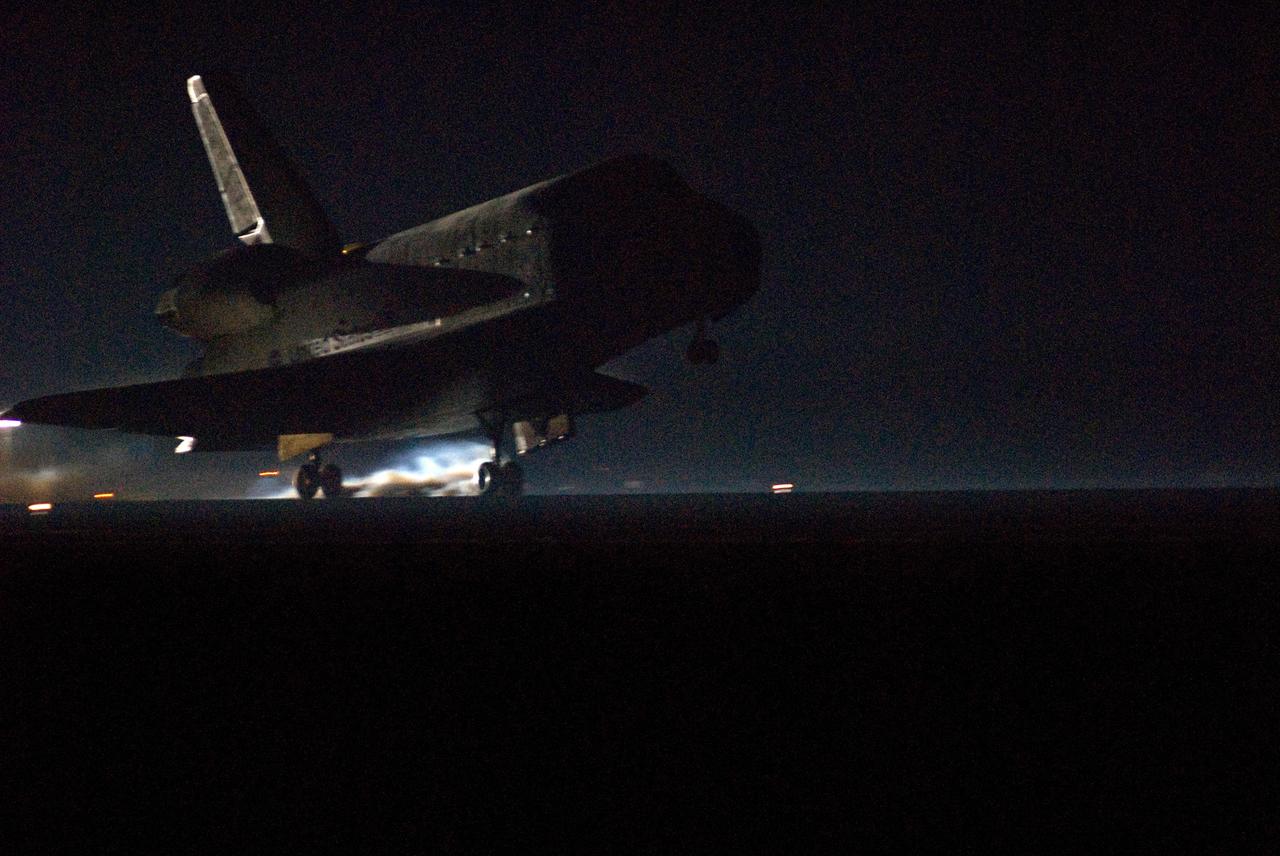 CAPE CANAVERAL, Fla. --- As night settles in on NASA's Kennedy Space Center, space shuttle Endeavour touches down on Runway 15 at the Shuttle Landing Facility to end the STS-123 mission, a 16-day flight to the International Space Station.  This was the 16th night landing at Kennedy.  The main landing gear touched down at 8:39:08 p.m. EDT.  The nose landing gear touched down at 8:39:17 p.m. and wheel stop was at 8:40:41 p.m.  The mission completed nearly 6.6 million miles.  The landing was on the second opportunity after the first was waved off due to unstable weather in the Kennedy Space Center area.  The STS-123 mission delivered the first segment of the Japan Aerospace Exploration Agency's Kibo laboratory and the Canadian Space Agency's two-armed robotic system, known as Dextre.  Photo credit: NASA/Tom Joseph