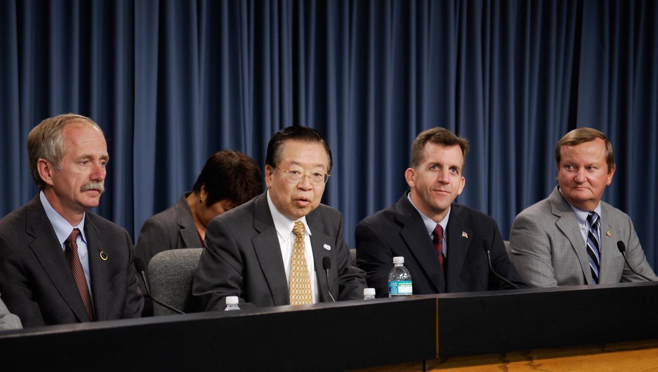 CAPE CANAVERAL, Fla. --- After the successful landing of space shuttle Endeavour to conclude the STS-123 mission, NASA officials hold a media briefing. The participants are, left to right, Bill Gerstenmaier, NASA associate administrator for Space Operations; Kaoru Mamiya, Japan Aerospace Exploration Agency vice president; LeRoy Cain, chair of the mission management team; and Mike Leinbach, NASA space shuttle launch director.  Endeavour landed on the second opportunity, on orbit 250, at 8:39:08 p.m. EDT.  The STS-123 mission delivered the first segment of the Japan Aerospace Exploration Agency's Kibo laboratory and the Canadian Space Agency's two-armed robotic system, known as Dextre.   Photo credit: NASA/Kim Shiflett