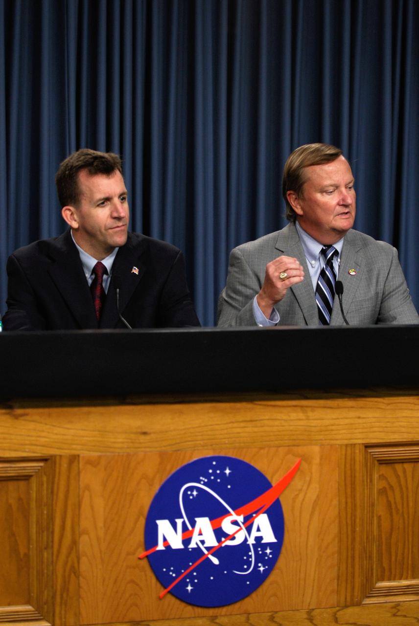 CAPE CANAVERAL, Fla. --- After the successful landing of space shuttle Endeavour to conclude the STS-123 mission, NASA officials hold a media briefing. The participants are, left to right, LeRoy Cain, chair of the mission management team; and Mike Leinbach, NASA space shuttle launch director.  Endeavour landed on the second opportunity, on orbit 250, at 8:39:08 p.m. EDT.  The STS-123 mission delivered the first segment of the Japan Aerospace Exploration Agency's Kibo laboratory and the Canadian Space Agency's two-armed robotic system, known as Dextre.   Photo credit: NASA/Kim Shiflett