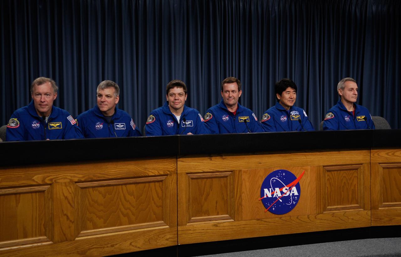 CAPE CANAVERAL, Fla. --- Space shuttle Endeavour crew members meet with the media to discuss their experiences on the STS-123 mission to the International Space Station. From left are Commander Dominic Gorie, Pilot Gregory H. Johnson, and Mission Specialists Robert L. Behnken, Mike Foreman, Japan Aerospace Exploration Agency astronaut Takao Doi and Rick Linnehan. They landed at Kennedy at 8:39 p.m. EDT March 26. Endeavour's 16-day flight was the longest shuttle mission to the International Space Station and included a record five spacewalks. The shuttle's seven astronauts worked with the three-member station crew and ground teams around the world to install the first section of the Japan Aerospace Exploration Agency's Kibo laboratory and the Canadian Space Agency's two-armed robotic system, known as Dextre. Photo credit: NASA/Kim Shiflett