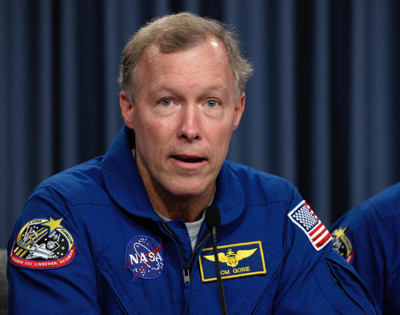CAPE CANAVERAL, Fla. ---  STS-123 Commander Dominic Gorie talks to the media about his experiences on the mission to the International Space Station.  The crew landed at Kennedy aboard space shuttle Endeavour at 8:39 p.m. EDT March 26.  Endeavour's 16-day flight was the longest shuttle mission to the International Space Station and included a record five spacewalks. The shuttle's seven astronauts worked with the three-member station crew and ground teams around the world to install the first section of the Japan Aerospace Exploration Agency's Kibo laboratory and the Canadian Space Agency's two-armed robotic system, known as Dextre.  Photo credit: NASA/Kim Shiflett