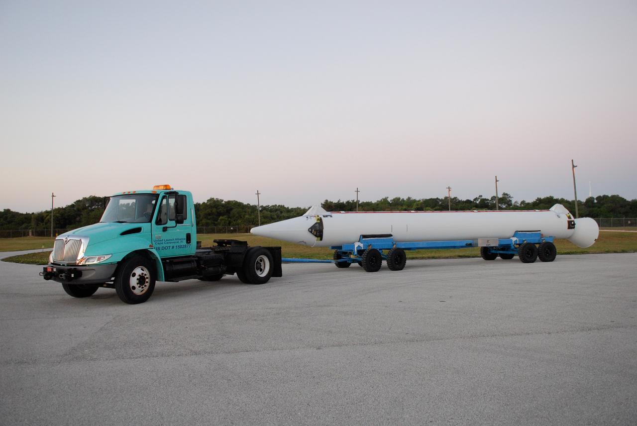 CAPE CANAVERAL, Fla. ---   The first solid rocket motor arrives at Pad 17-B on Cape Canaveral Air Force Station for mating with the Delta II rocket to launch NASA's Gamma-ray Large Area Space Telescope, or GLAST, spacecraft.  A series of nine strap-on solid rocket motors will help power the first stage. The GLAST is a powerful space observatory that will explore the Universe's ultimate frontier, where nature harnesses forces and energies far beyond anything possible on Earth;  probe some of science's deepest questions, such as what our Universe is made of, and search for new laws of physics; explain how black holes accelerate jets of material to nearly light speed; and help crack the mystery of stupendously powerful explosions known as gamma-ray bursts.  Launch is currently planned for May 16 from Pad 17-B.   Photo credit: NASA/Dimitri Gerondidakis