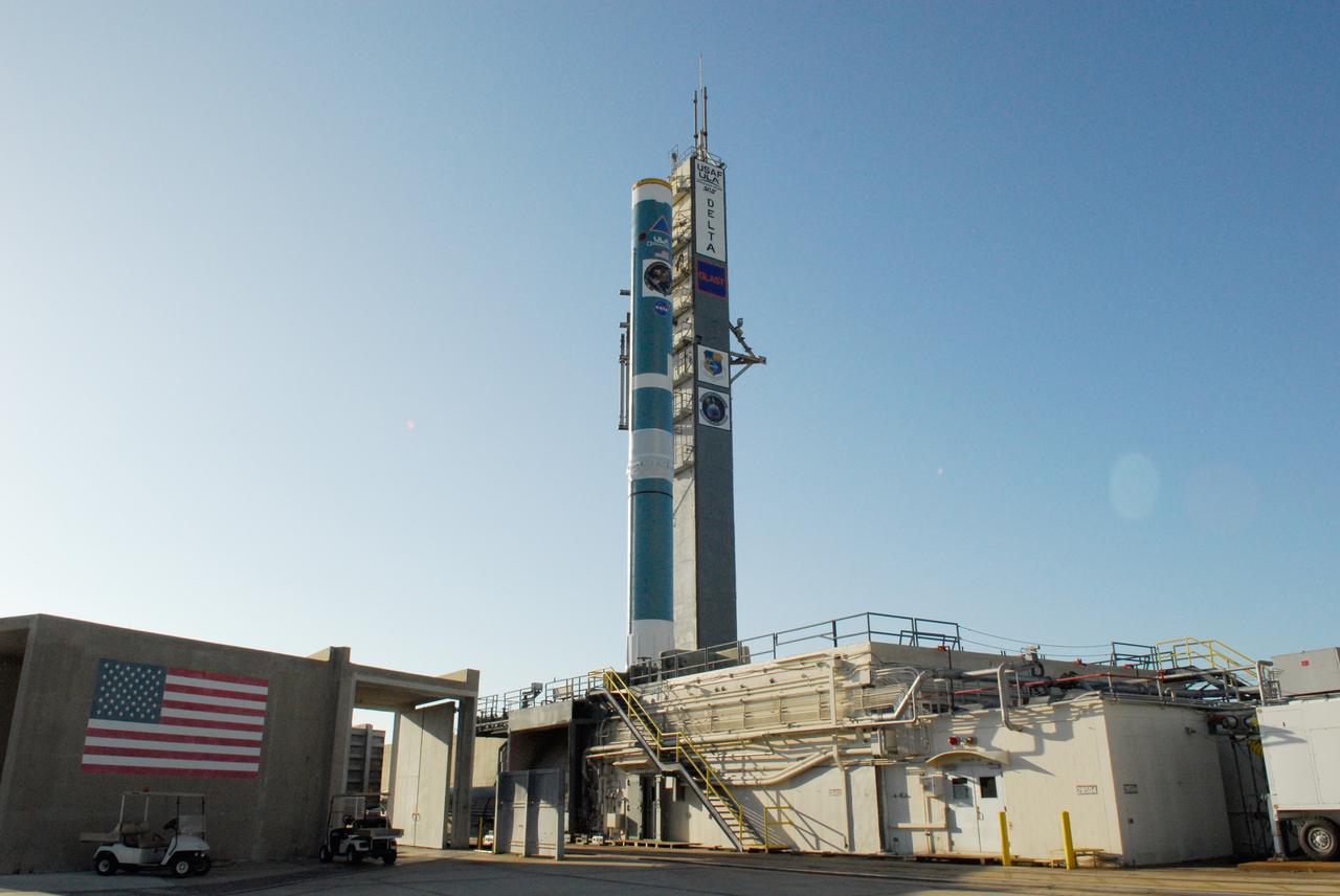 CAPE CANAVERAL, Fla. ---   At Cape Canaveral Air Force Station, the Delta II rocket to launch NASA's Gamma-ray Large Area Space Telescope, or GLAST, spacecraft is poised to receive the first of the solid rocket boosters.  A series of nine strap-on solid rocket motors will help power the first stage. The GLAST is a powerful space observatory that will explore the Universe's ultimate frontier, where nature harnesses forces and energies far beyond anything possible on Earth;  probe some of science's deepest questions, such as what our Universe is made of, and search for new laws of physics; explain how black holes accelerate jets of material to nearly light speed; and help crack the mystery of stupendously powerful explosions known as gamma-ray bursts.  Launch is currently planned for May 16 from Pad 17-B.   Photo credit: NASA/Dimitri Gerondidakis