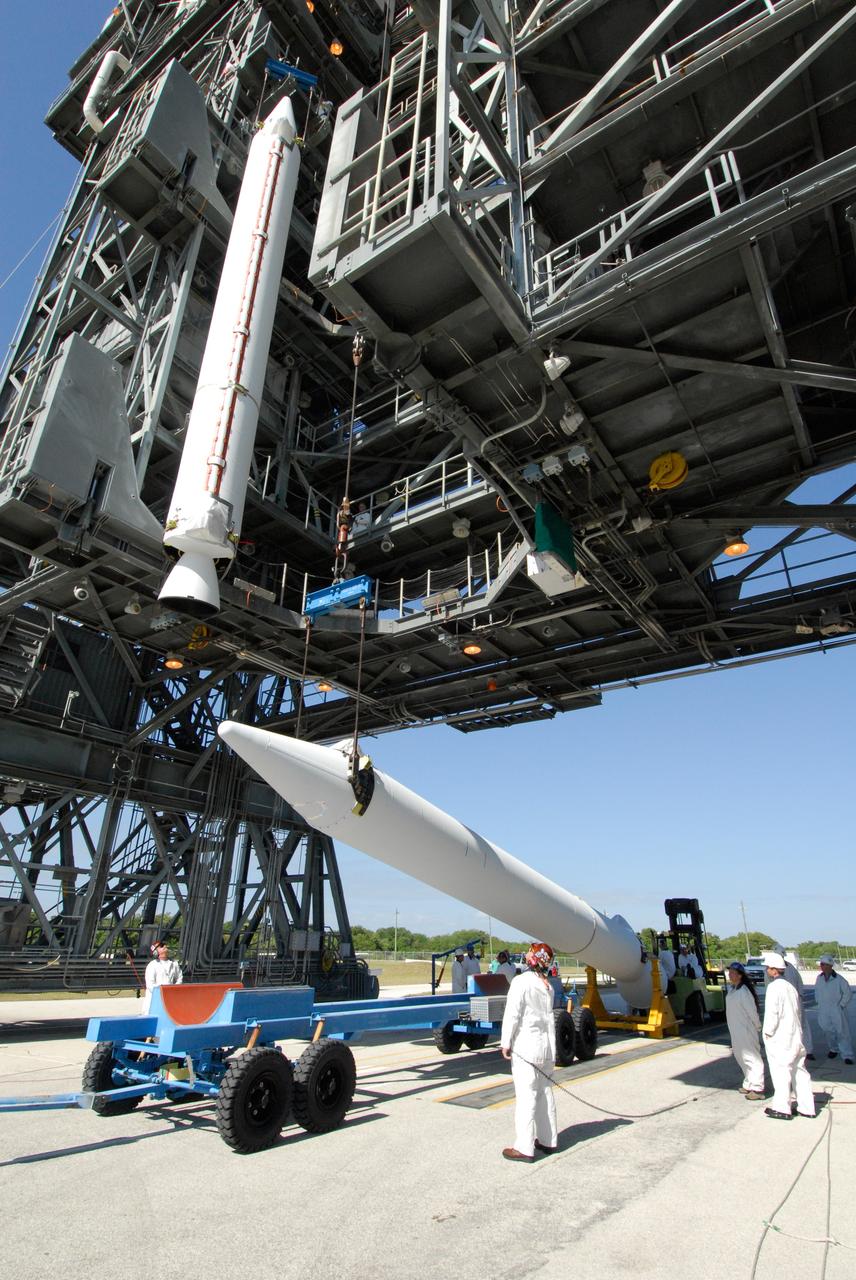 CAPE CANAVERAL, Fla. ---  At Pad 17-B on Cape Canaveral Air Force Station, a second solid rocket booster is raised from its transporter.  The booster will join the first booster lifted into the mobile service tower for mating with the Delta II rocket to launch NASA's Gamma-ray Large Area Space Telescope, or GLAST, spacecraft.  A series of nine strap-on solid rocket motors will help power the first stage.  The GLAST is a powerful space observatory that will explore the Universe's ultimate frontier, where nature harnesses forces and energies far beyond anything possible on Earth;  probe some of science's deepest questions, such as what our Universe is made of, and search for new laws of physics; explain how black holes accelerate jets of material to nearly light speed; and help crack the mystery of stupendously powerful explosions known as gamma-ray bursts.  Launch is currently planned for May 16 from Pad 17-B.   Photo credit: NASA/Dimitri Gerondidakis