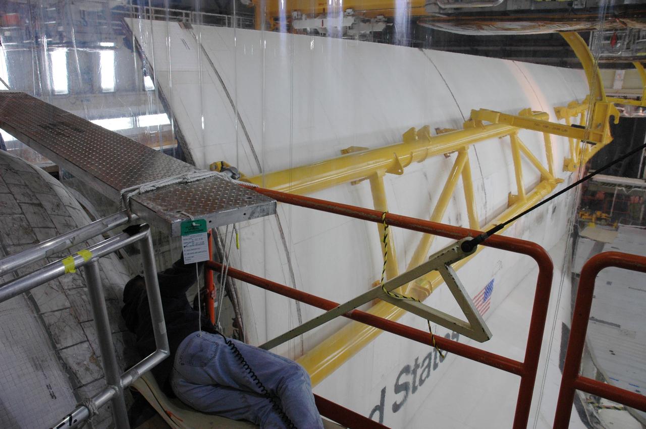 CAPE CANAVERAL, Fla. ---In Orbiter Processing Facility Bay 3 at NASA's Kennedy Space Center, space shuttle Discovery's second payload bay door is nearly closed. Discovery is the designated vehicle on the STS-124 mission to the International Space Station.  On the mission, the shuttle will transport the Kibo Japanese Experiment Module - Pressurized Module and the Japanese Remote Manipulator System. The payload will be installed at the launch pad.  Launch is targeted for May 25.  Photo credit: NASA/Chris Rhodes