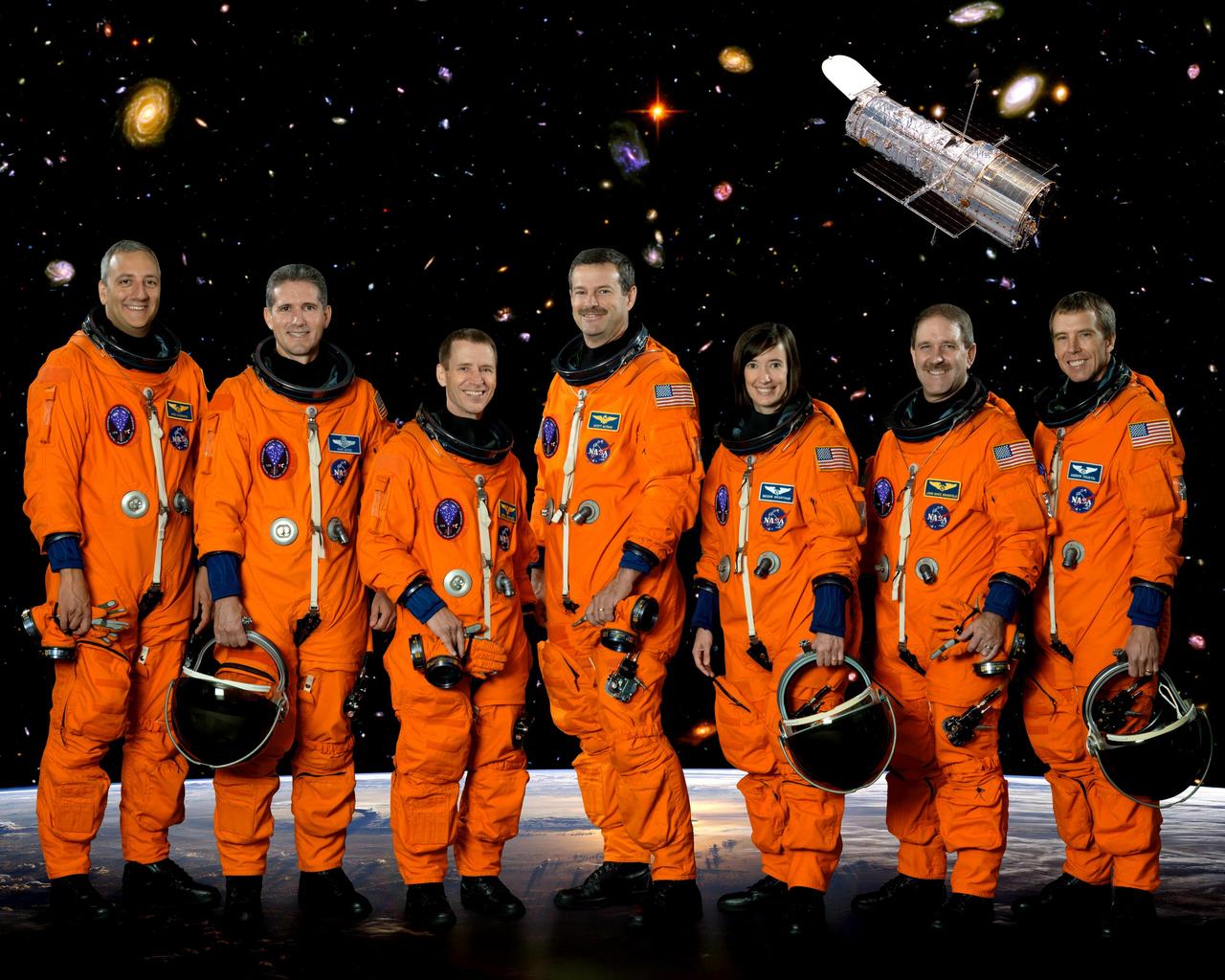 JOHNSON SPACE CENTER, Houston, Texas --- STS125-S-002 (9 Oct. 2007) --- These seven astronauts take a break from training to pose for the STS-125 crew portrait. From the left are astronauts Michael J. Massimino and Michael T. Good, both mission specialists; Gregory C. Johnson, pilot; Scott D. Altman, commander; and K. Megan McArthur, John M. Grunsfeld and Andrew J. Feustel, all mission specialists. The STS-125 mission will be the final space shuttle mission to the Hubble Space Telescope.