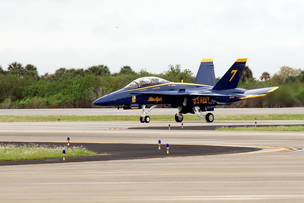 CAPE CANAVERAL, Fla. -- A U.S. Navy F-18 Hornet lands at the Shuttle Landing Facility at NASA's Kennedy Space Center.  Aboard are Blue Angel pilots Lt. Frank Weisser and Lt. Dan McShane.  They flew into Kennedy to begin preparations for their involvement in the second annual Space & Air Show at Kennedy Space Center Nov. 8-9.  The air show will be only the second time the Blue Angels have performed at Kennedy.  Their precision flight team will perform high-speed passes, fast rolls, mirror formations, tight turns and their signature Delta formation showcasing the capabilities of the powerful aircraft.  The 2008 Space & Air Show will include aircraft displays and space-related exhibits on the ground and plenty of action in the skies over Kennedy.  Returning to the show is the 920th Rescue Wing, an Air Force Reserve Command combat search and rescue unit based at Patrick Air Force Base in Central Florida. Also, more than 20 astronauts and special guests will be on hand to personally meet guests, pose for photos and sign memorabilia.  Photo credit: NASA/Kim Shiflett
