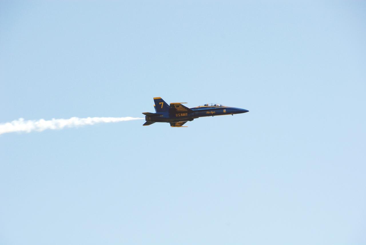 CAPE CANAVERAL, Fla. -- After meeting with NASA officials about their involvement in the second annual Space & Air Show at Kennedy Space Center Nov. 8-9, Blue Angel pilots Lt. Frank Weisser and Lt. Dan McShane take a last look at the center from their U.S. Navy F-18 Hornet as they return to their home base in Pensacola, Fla.   The air show will be only the second time the Blue Angels have performed at Kennedy.  Their precision flight team will perform high-speed passes, fast rolls, mirror formations, tight turns and their signature Delta formation showcasing the capabilities of the powerful aircraft.  The 2008 Space & Air Show will include aircraft displays and space-related exhibits on the ground and plenty of action in the skies over Kennedy.  Returning to the show is the 920th Rescue Wing, an Air Force Reserve Command combat search and rescue unit based at Patrick Air Force Base in Central Florida. Also, more than 20 astronauts and special guests will be on hand to personally meet guests, pose for photos and sign memorabilia.  Photo credit: NASA/Dimitri Gerondidakis