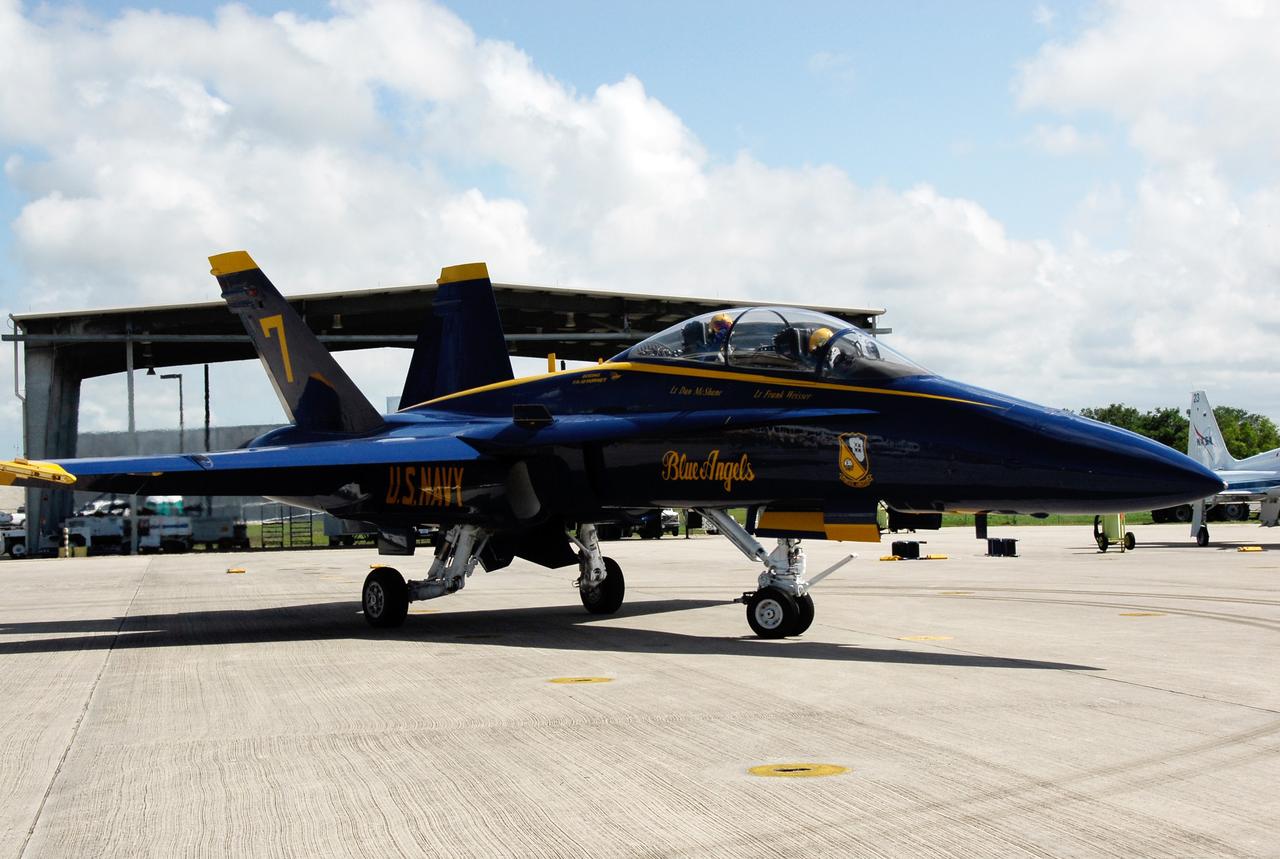 CAPE CANAVERAL, Fla. -- After meeting with NASA officials about their involvement in the second annual Space & Air Show at Kennedy Space Center Nov. 8-9, Blue Angel pilots Lt. Frank Weisser and Lt. Dan McShane prepare for takeoff of their U.S. Navy F-18 Hornet from the Shuttle Landing Facility for the return flight to their home base in Pensacola, Fla.    The air show will be only the second time the Blue Angels have performed at Kennedy.  Their precision flight team will perform high-speed passes, fast rolls, mirror formations, tight turns and their signature Delta formation showcasing the capabilities of the powerful aircraft.  The 2008 Space & Air Show will include aircraft displays and space-related exhibits on the ground and plenty of action in the skies over Kennedy.  Returning to the show is the 920th Rescue Wing, an Air Force Reserve Command combat search and rescue unit based at Patrick Air Force Base in Central Florida. Also, more than 20 astronauts and special guests will be on hand to personally meet guests, pose for photos and sign memorabilia.  Photo credit: NASA/Kim Shiflett