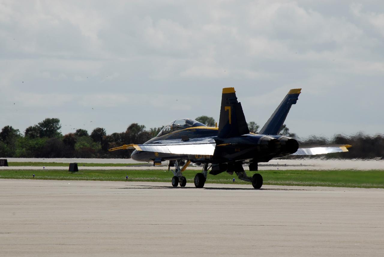 CAPE CANAVERAL, Fla. -- After meeting with NASA officials about their involvement in the second annual Space & Air Show at Kennedy Space Center Nov. 8-9, Blue Angel pilots Lt. Frank Weisser and Lt. Dan McShane prepare for takeoff of their U.S. Navy F-18 Hornet from the Shuttle Landing Facility for the return flight to their home base in Pensacola, Fla.   The air show will be only the second time the Blue Angels have performed at Kennedy.  Their precision flight team will perform high-speed passes, fast rolls, mirror formations, tight turns and their signature Delta formation showcasing the capabilities of the powerful aircraft.  The 2008 Space & Air Show will include aircraft displays and space-related exhibits on the ground and plenty of action in the skies over Kennedy.  Returning to the show is the 920th Rescue Wing, an Air Force Reserve Command combat search and rescue unit based at Patrick Air Force Base in Central Florida. Also, more than 20 astronauts and special guests will be on hand to personally meet guests, pose for photos and sign memorabilia.  Photo credit: NASA/Kim Shiflett