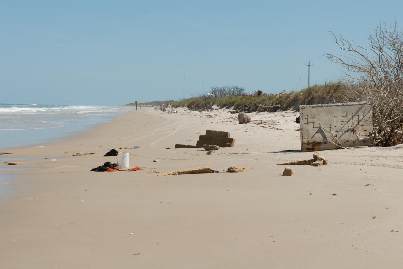CAPE CANAVERAL, Fla. --   A beach on NASA's Kennedy Space Center is the site designated for cleanup of debris.  More than 130 volunteers from the joint NASA’s Kennedy Space Center and U.S. Fish and Wildlife Service contract organizations give up their afternoon to gather all the “unnatural” items that had accumulated on 6.1 miles of central Florida east coast shoreline during the past 12 months.  Part of the center's dedication to a clean environment,  volunteers gathered enough trash to fill approximately 450 garbage bags and enough recyclable plastic and glass to fill 150 bags.   Photo credit: NASA/Dimitri Gerondidakis