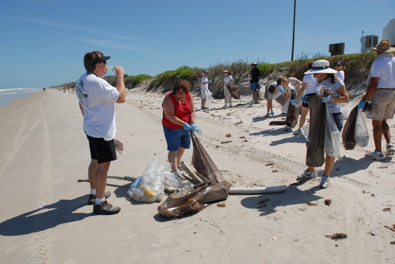 CAPE CANAVERAL, Fla. --   On a beach on NASA's Kennedy Space Center, more than 130 volunteers from the joint NASA’s Kennedy Space Center and U.S. Fish and Wildlife Service contract organizations give up their afternoon to gather all the “unnatural” items that had accumulated on 6.1 miles of central Florida east coast shoreline during the past 12 months. Part of the center's dedication to a clean environment,  volunteers gathered enough trash to fill approximately 450 garbage bags and enough recyclable plastic and glass to fill 150 bags.   Photo credit: NASA/Dimitri Gerondidakis