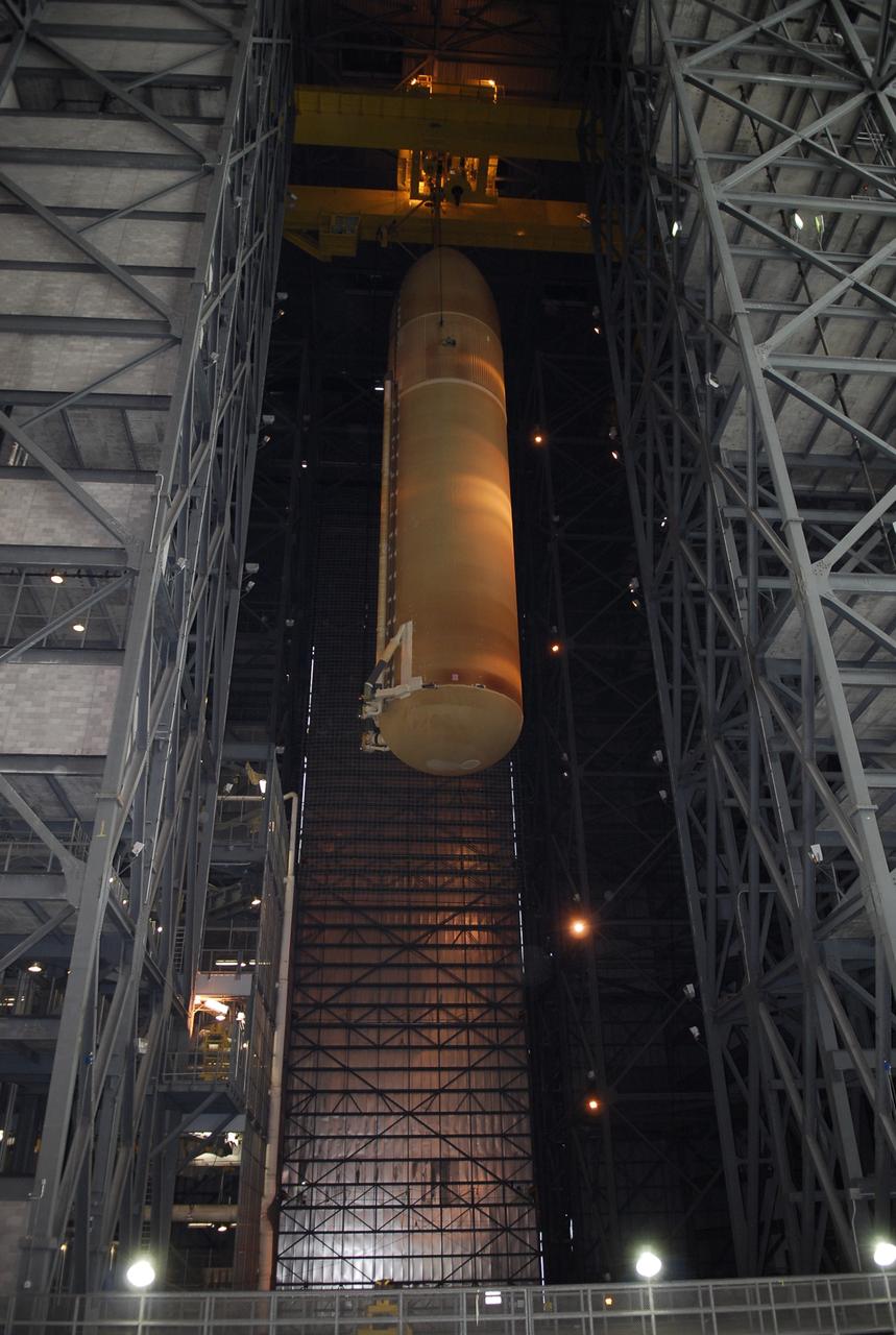 CAPE CANAVERAL, Fla. -- In the Vehicle Assembly Building at NASA's Kennedy Space Center, the external tank for space shuttle Discovery is being lowered into high bay 3. The tank will be mated to the solid rocket boosters waiting below on the mobile launcher platform. Discovery is targeted to launch May 31 on the STS-124 mission to the International Space Station. On the mission, Discovery will transport the Kibo Japanese Experiment Module - Pressurized Module (JEM-PM) and the Japanese Remote Manipulator System (JEM-RMS) to the space station to add to the Kibo laboratory. Photo credit: NASA/Kim Shiflett
