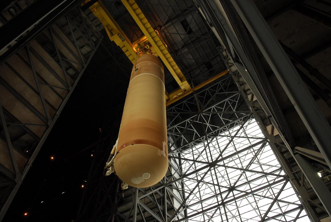 CAPE CANAVERAL, Fla. -- In the Vehicle Assembly Building at NASA's Kennedy Space Center, the external tank for space shuttle Discovery is being lowered into high bay 3. The tank will be mated to the solid rocket boosters waiting below on the mobile launcher platform. Discovery is targeted to launch May 31 on the STS-124 mission to the International Space Station. On the mission, Discovery will transport the Kibo Japanese Experiment Module - Pressurized Module (JEM-PM) and the Japanese Remote Manipulator System (JEM-RMS) to the space station to add to the Kibo laboratory. Photo credit: NASA/Kim Shiflett