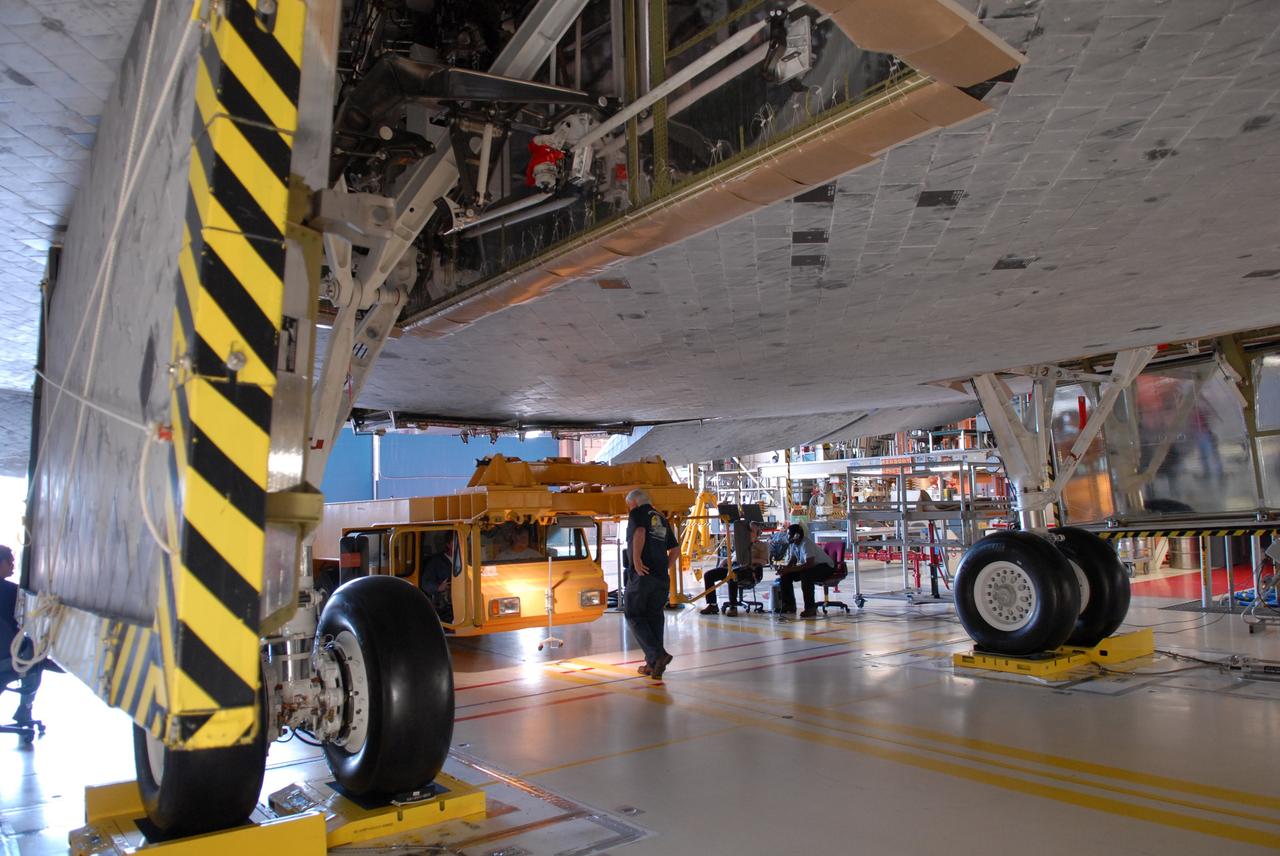 CAPE CANAVERAL, Fla. -- In Orbiter Processing Facility Bay 3 at NASA’s Kennedy Space Center, space shuttle Discovery is ready for the Orbiter Transport System, or OTS (left), to be rolled in underneath. The OTS will help move the orbiter on its rollover to the Vehicle Assembly Building. Discovery is targeted to launch May 31 on the STS-124 mission to the International Space Station. On the mission, Discovery will transport the Kibo Japanese Experiment Module - Pressurized Module (JEM-PM) and the Japanese Remote Manipulator System (JEM-RMS) to the space station to add to the Kibo laboratory. Photo credit: NASA/Troy Cryder