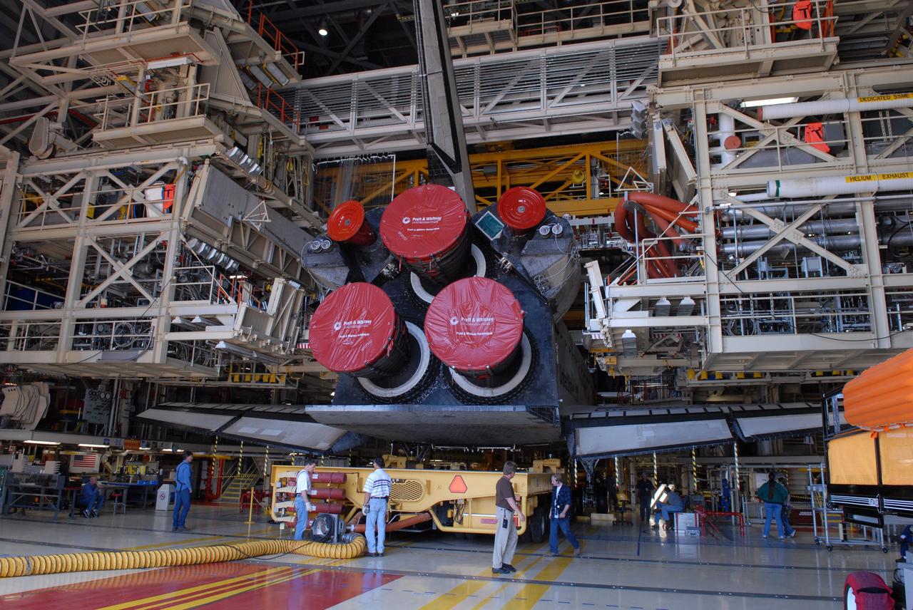 CAPE CANAVERAL, Fla. -- In Orbiter Processing Facility Bay 3 at NASA’s Kennedy Space Center, the Orbiter Transport System, or OTS, moves in place under the belly of space shuttle Discovery. The OTS will help move the orbiter on its rollover to the Vehicle Assembly Building. Discovery is targeted to launch May 31 on the STS-124 mission to the International Space Station. On the mission, Discovery will transport the Kibo Japanese Experiment Module - Pressurized Module (JEM-PM) and the Japanese Remote Manipulator System (JEM-RMS) to the space station to add to the Kibo laboratory. Photo credit: NASA/Troy Cryder