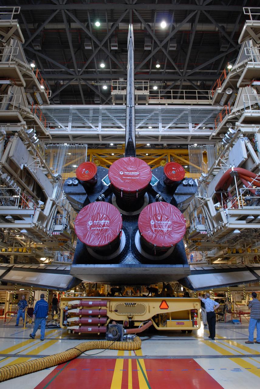 CAPE CANAVERAL, Fla. -- In Orbiter Processing Facility Bay 3 at NASA’s Kennedy Space Center, workers continue to secure the Orbiter Transport System, or OTS, under space shuttle Discovery. The OTS will help move the orbiter on its rollover to the Vehicle Assembly Building. Discovery is targeted to launch May 31 on the STS-124 mission to the International Space Station. On the mission, Discovery will transport the Kibo Japanese Experiment Module - Pressurized Module (JEM-PM) and the Japanese Remote Manipulator System (JEM-RMS) to the space station to add to the Kibo laboratory. Photo credit: NASA/Troy Cryder