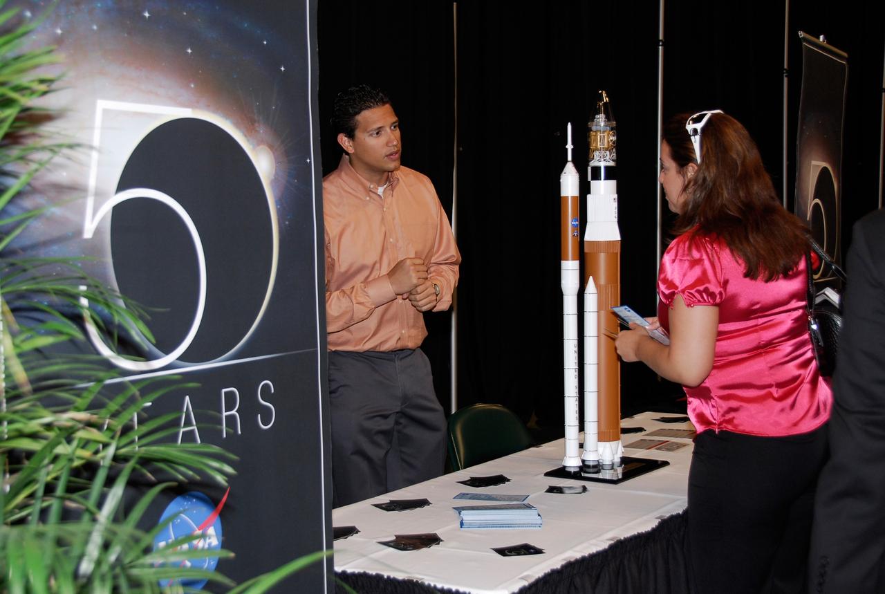 CAPE CANAVERAL, Fla. -- NASA displays an exhibit commemorating the agency’s 50th anniversary during a Future Forum in Miami that focuses on how space exploration benefits Florida's economy.  The event, which included presentations and panels, was held at the University of Miami's BankUnited Center.  Among those participating were NASA Deputy Administrator Shana Dale, astronaut Carl Walz, director of the Advanced Capabilities Division in NASA's Exploration Systems Mission Directorate, and Russell Romanella, director, International Space Station and Spacecraft Processing.   Photo credit: NASA/Kim Shiflett