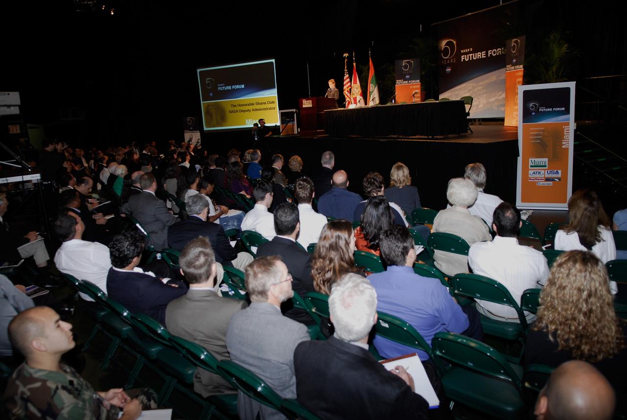 CAPE CANAVERAL, Fla. --  NASA Deputy Administrator Shana Dale (at the podium) gives the keynote address during a Future Forum in Miami. The forum, which focused on how space exploration benefits Florida's economy, was held at the University of Miami's BankUnited Center and included presentations and panels.  Among those participating were NASA Deputy Administrator Shana Dale, astronaut Carl Walz, director of the Advanced Capabilities Division in NASA's Exploration Systems Mission Directorate, and Russell Romanella, director, International Space Station and Spacecraft Processing.   Photo credit: NASA/Kim Shiflett