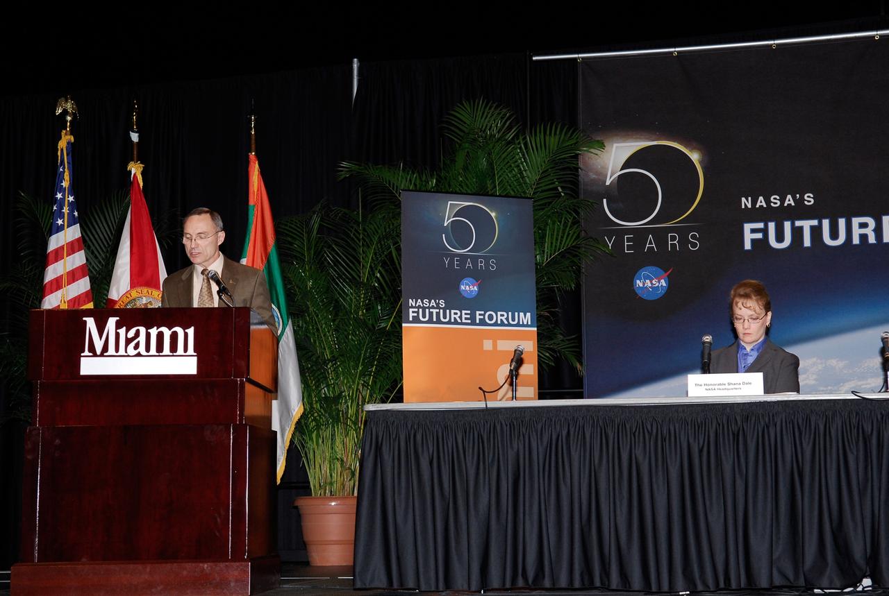 CAPE CANAVERAL, Fla. --  During NASA’s Future Forum in Miami, Carl Walz provides an overview of NASA’s Exploration Program.  Walz is director of the Advanced Capabilities Division.   At the table on the right is NASA Deputy Administrator Shana Dale. The forum focused on how space exploration benefits Florida's economy. The forum was held at the University of Miami's BankUnited Center and included presentations and panels.  Also participating was Russell Romanella, director of the International Space Station and Spacecraft Processing.   Photo credit: NASA/Kim Shiflett